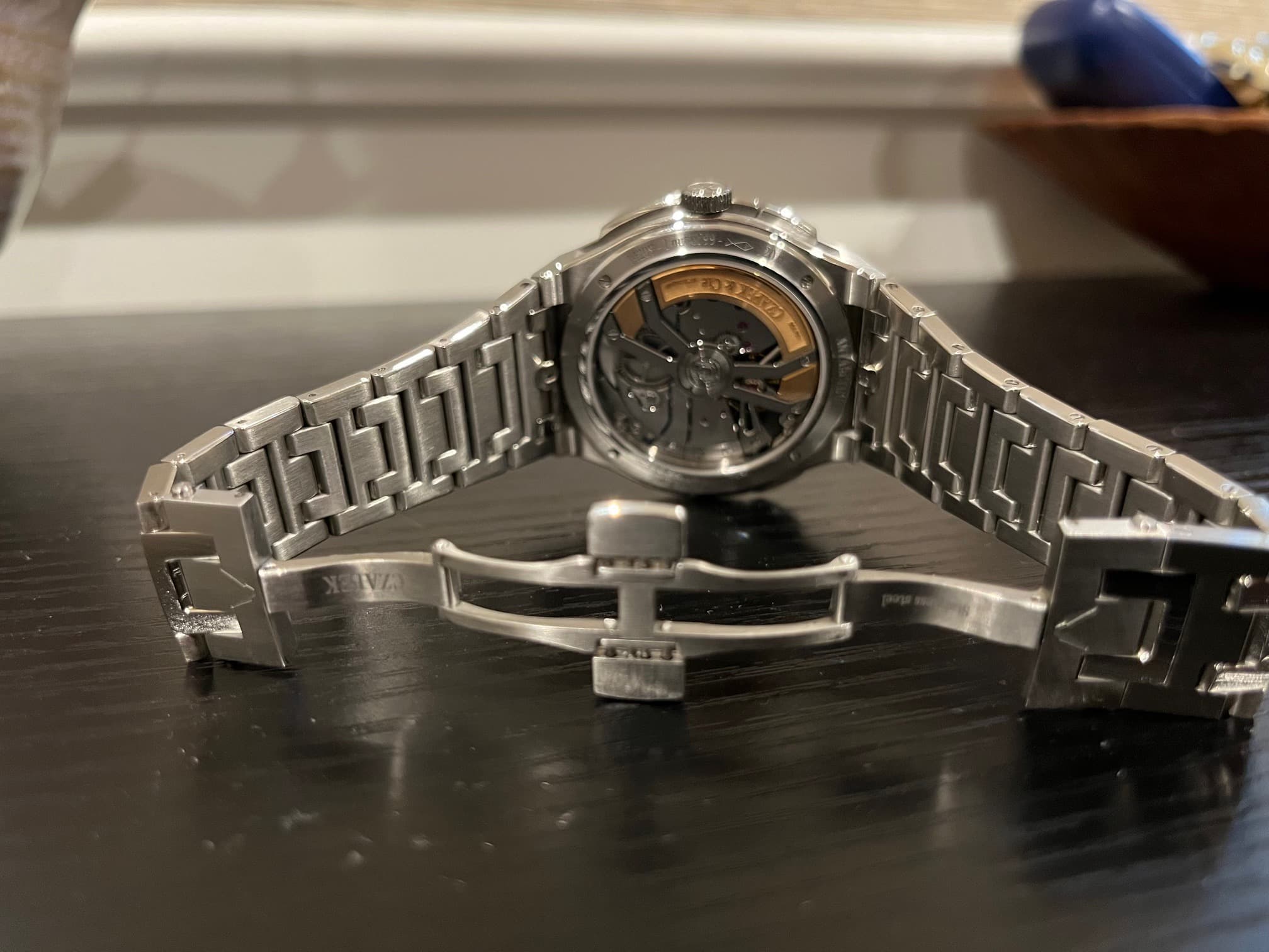 May be an image of wrist watch and text