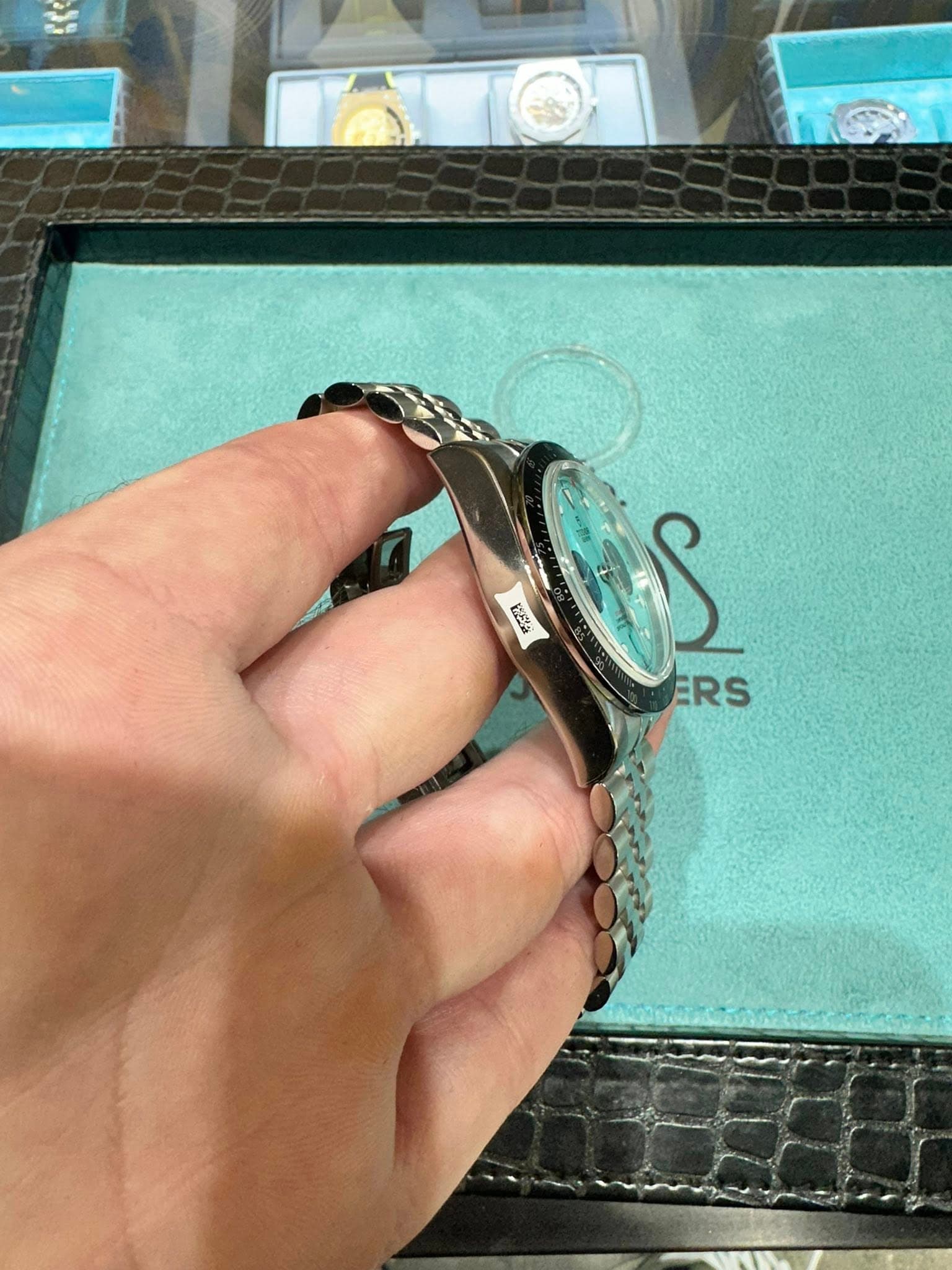 May be an image of wrist watch, ring and text