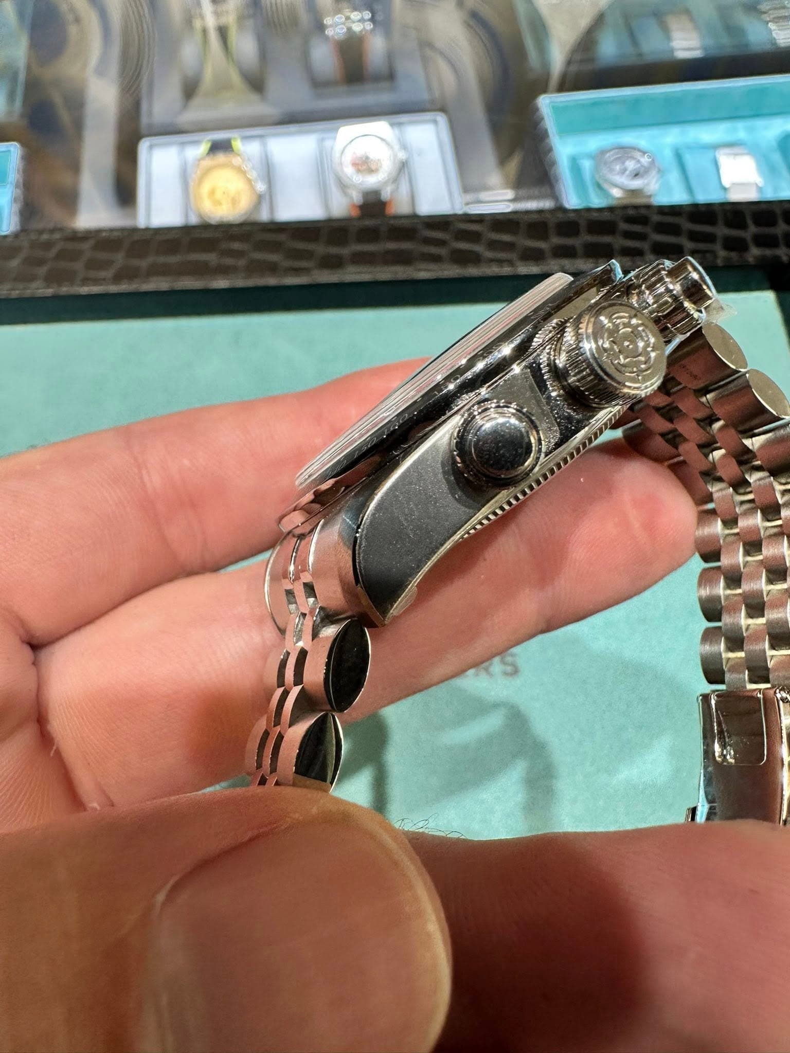May be an image of wrist watch, jewelry and text
