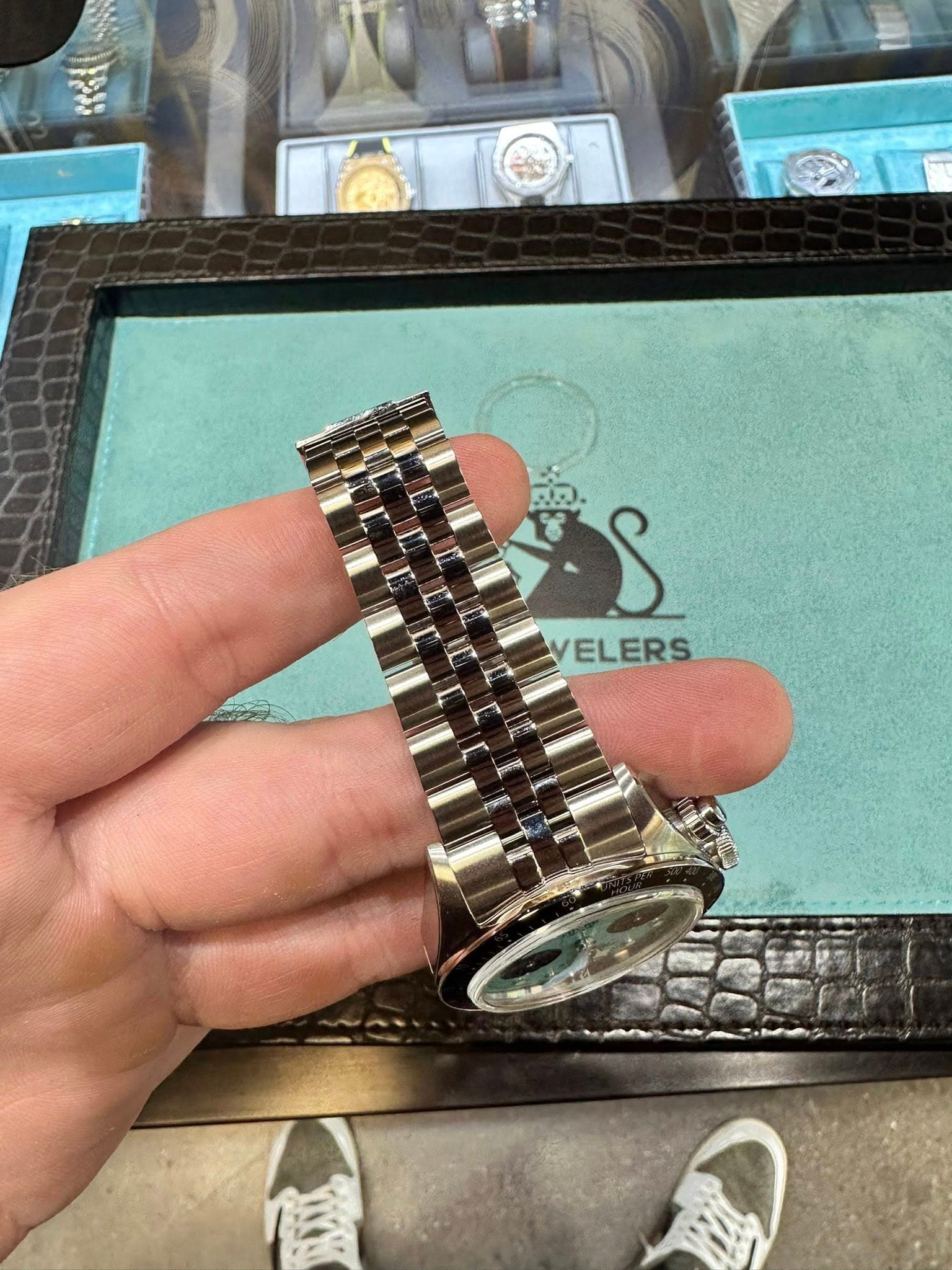 May be an image of wrist watch and text