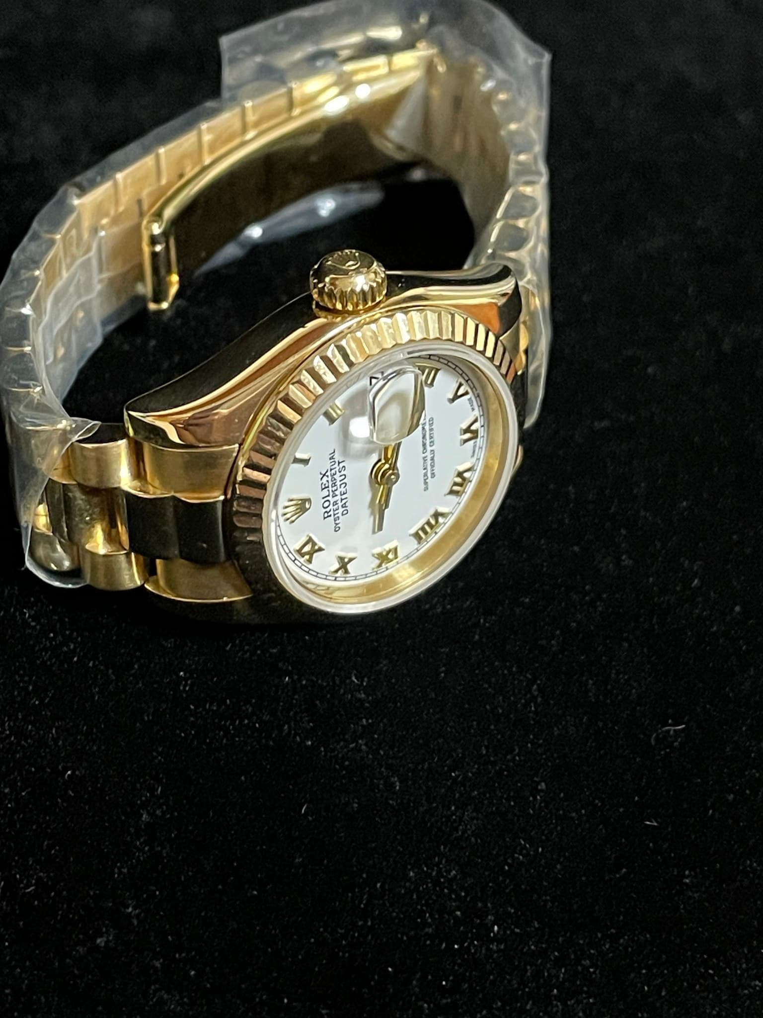 May be an image of wrist watch and text