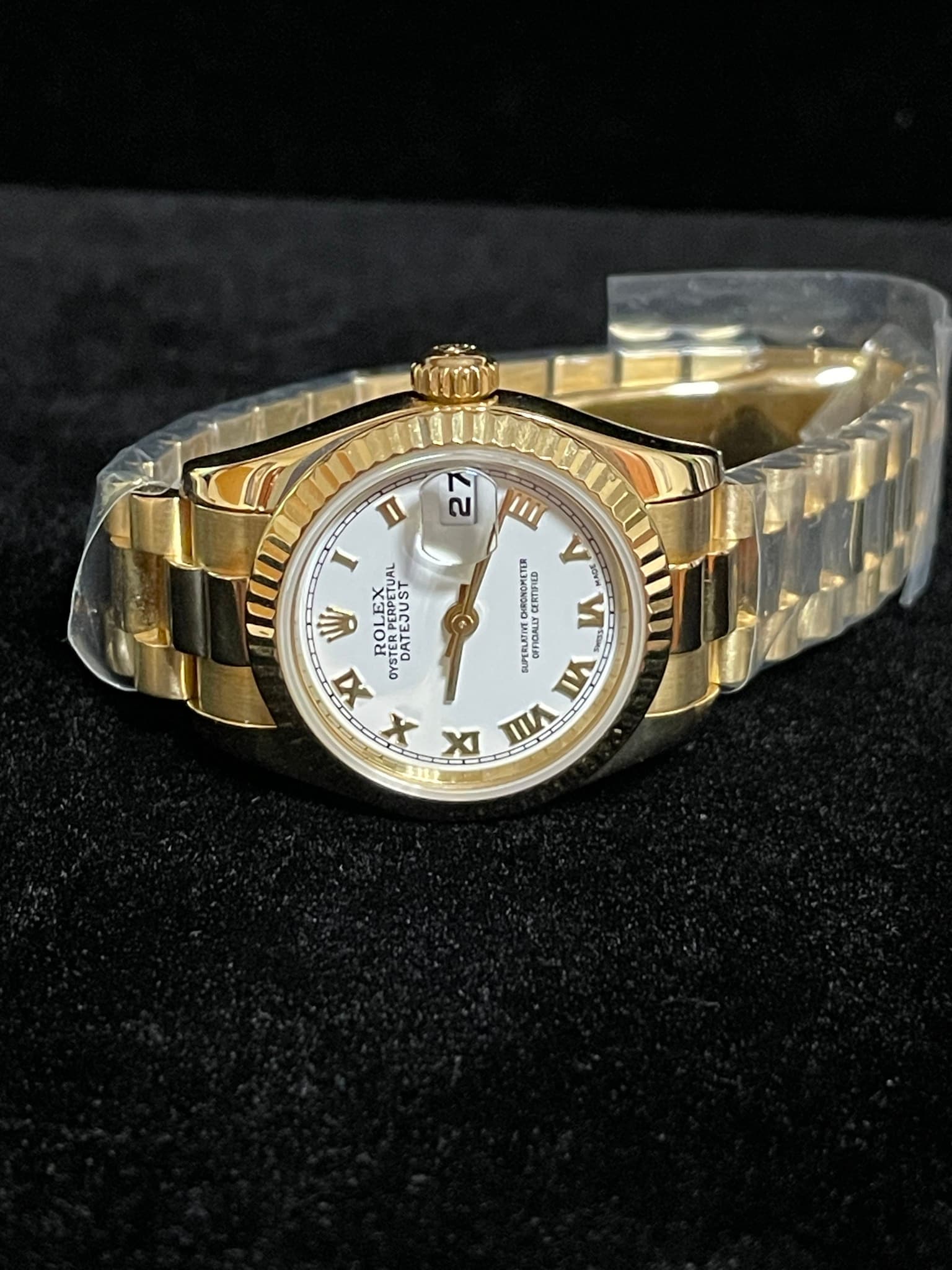 May be an image of wrist watch and text