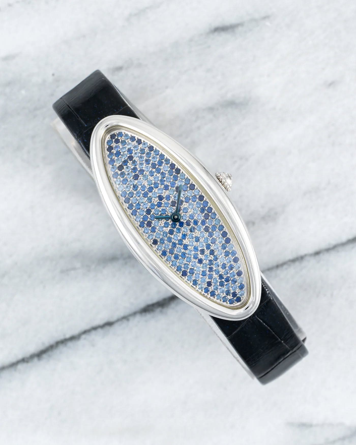 May be an image of wrist watch and text