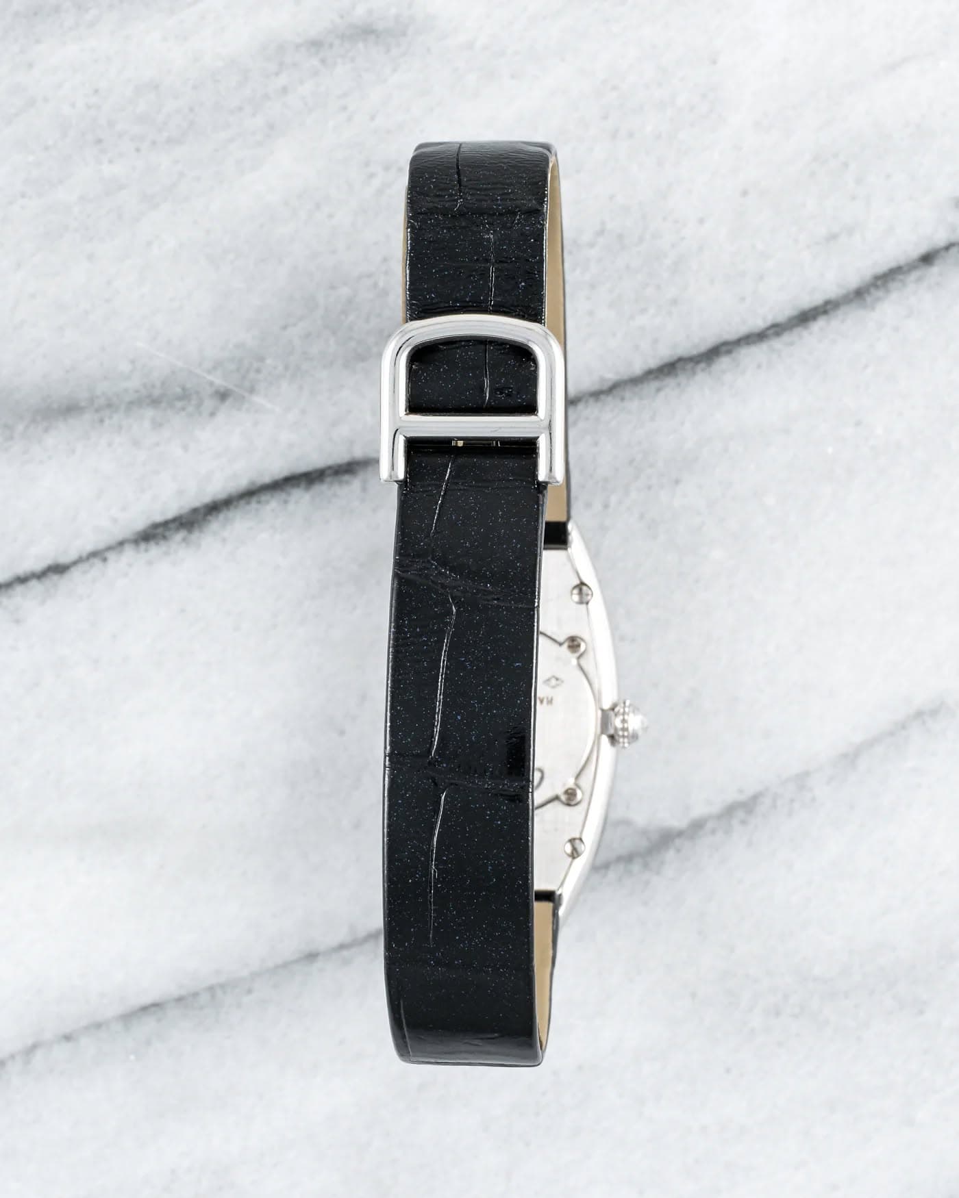 May be an image of wrist watch and leather