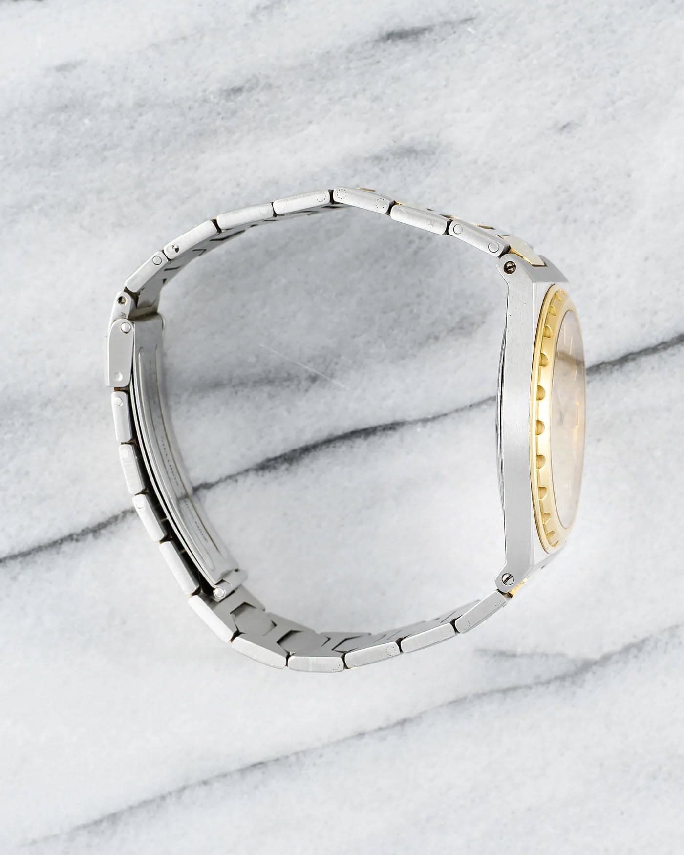 May be an image of wrist watch and jewelry