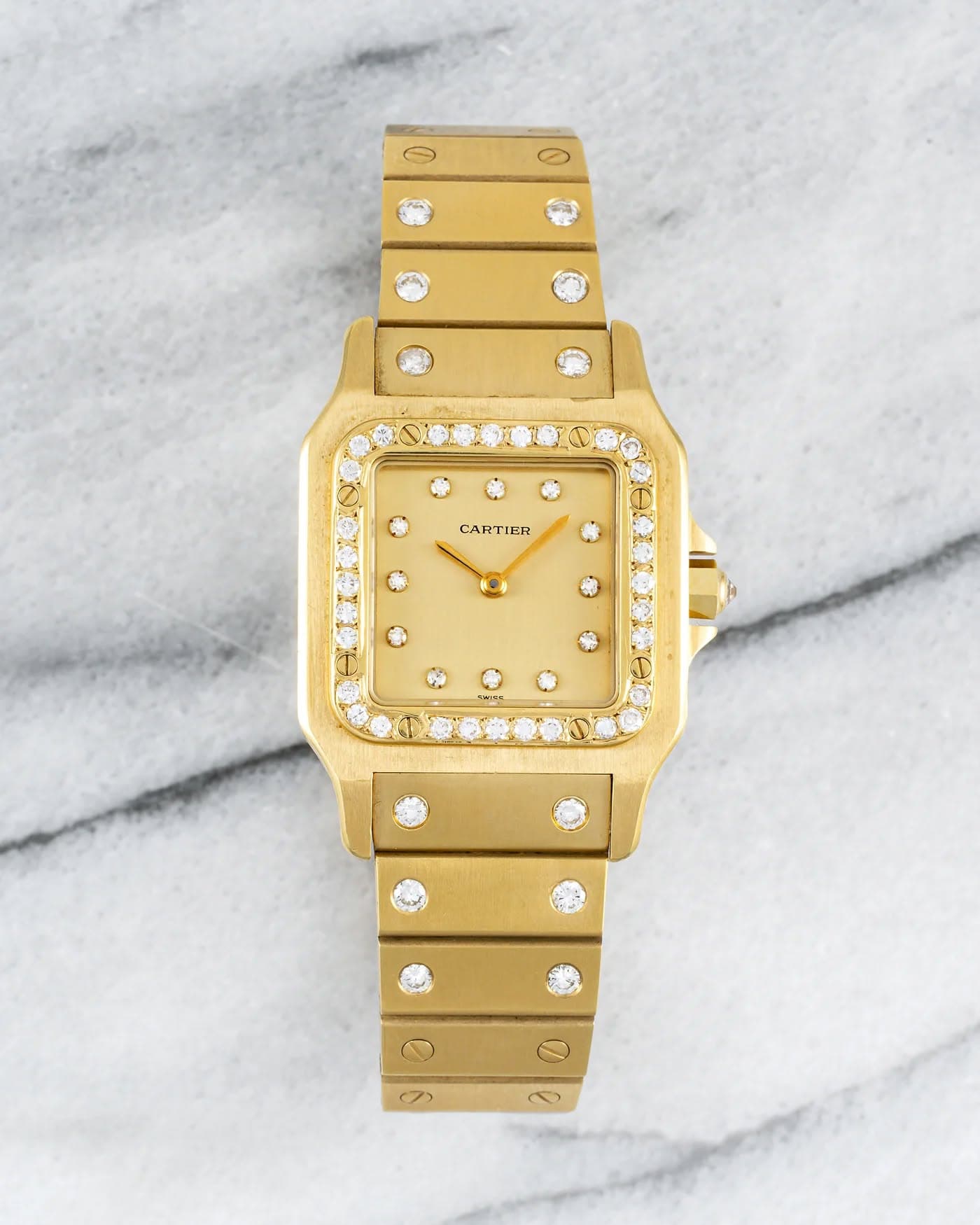 May be an image of wrist watch and jewelry