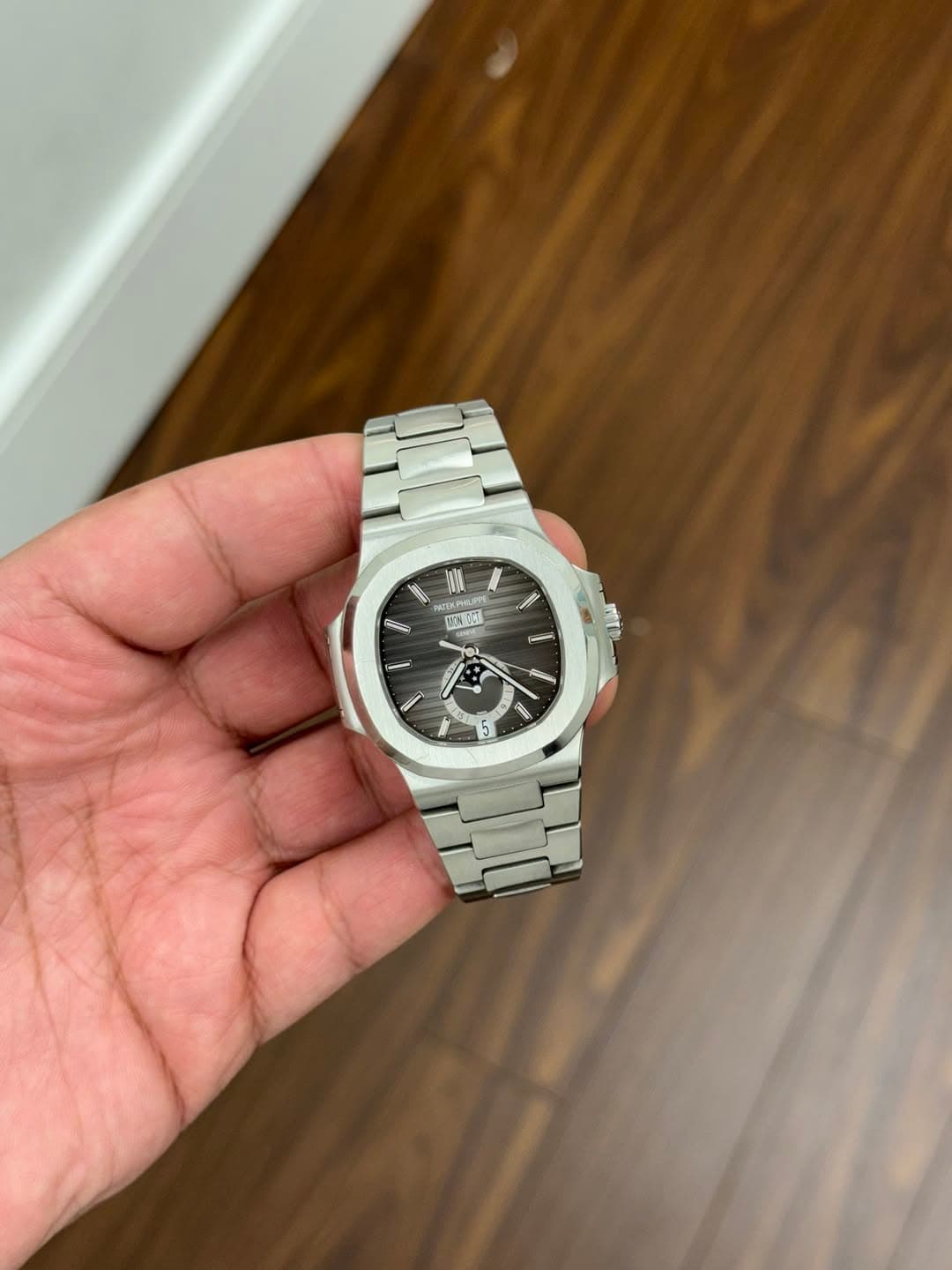 May be an image of wrist watch and text