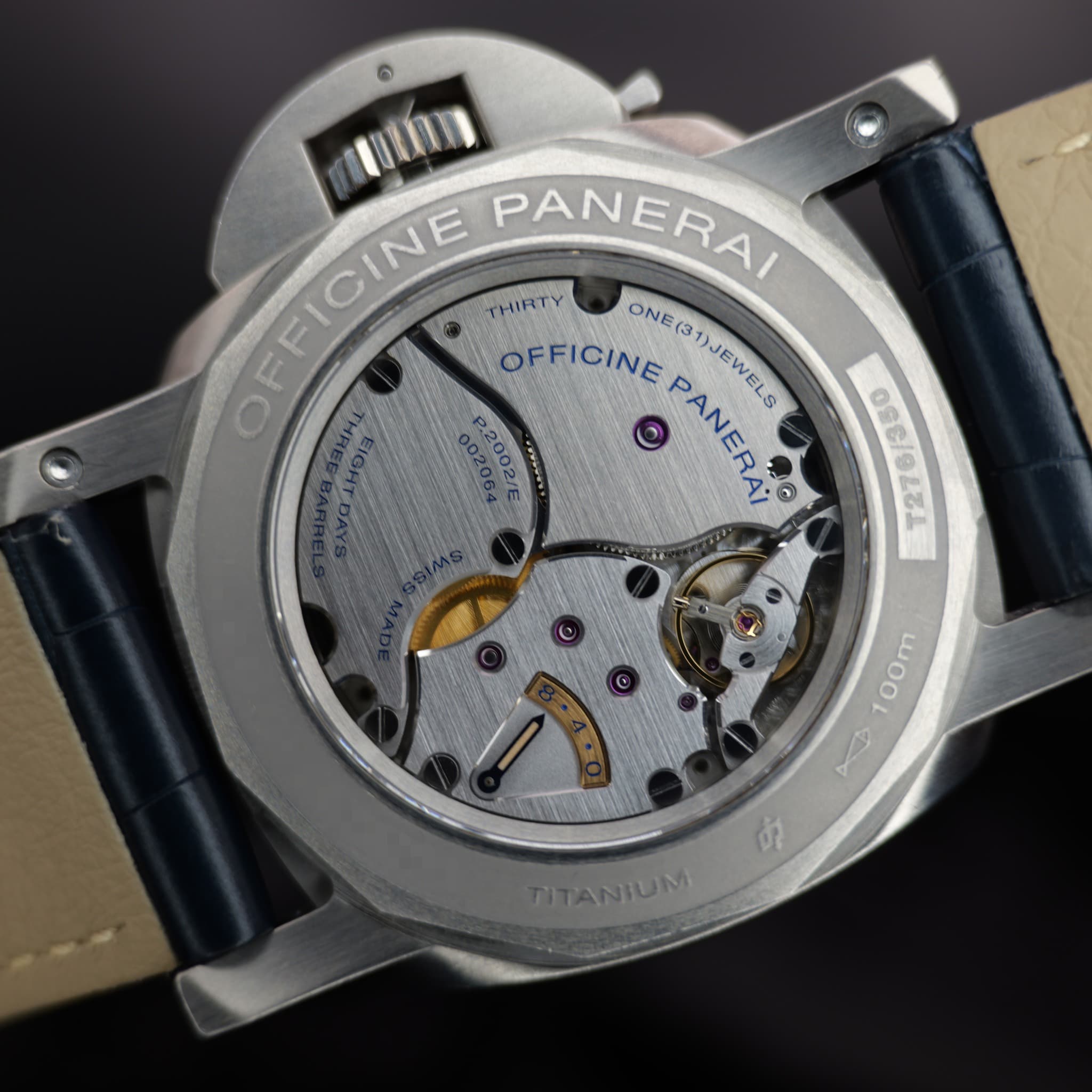 May be an image of wrist watch and text that says 'OFFICINE EFICINE NE PANERAI THIRTY OFFICINE ONE(31)JEWELS ONE( PANERA: PANERA® 0@ 1)JEWELS 110/1227 100m AE TITANTUM'