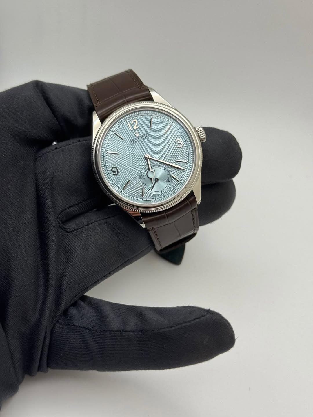May be an image of wrist watch and text