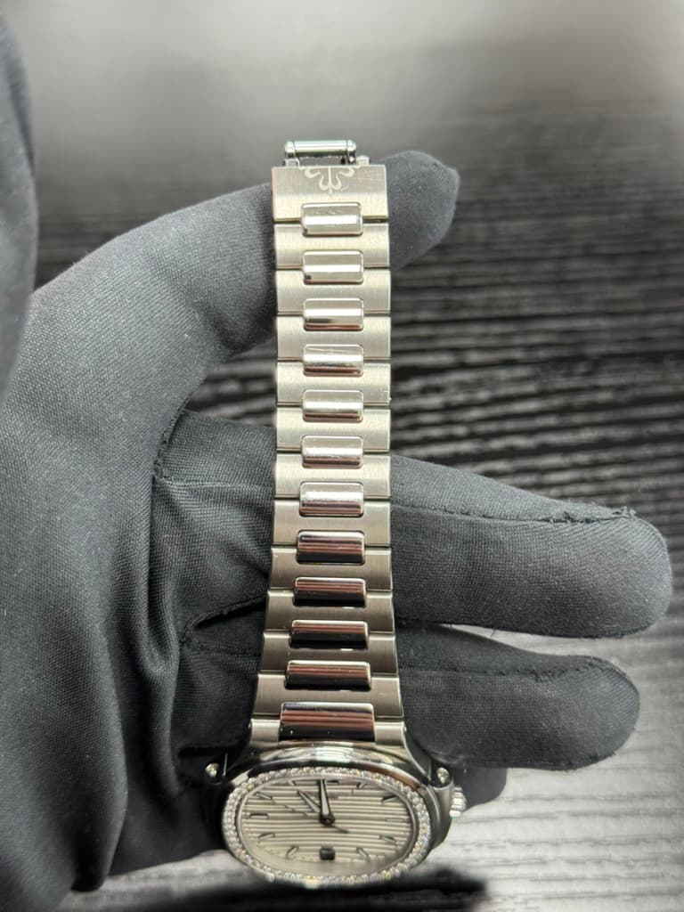 May be an image of 1 person and wrist watch