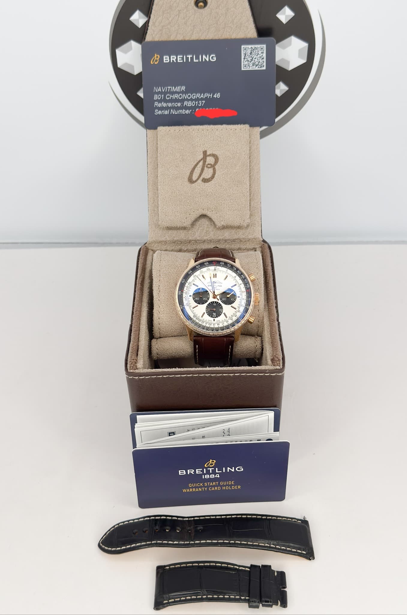May be an image of digital watch and text that says 'お BREITLING NAVITIMER BOYCHRONOGRAPH46 NOGRAPH 46 Refer Reference: teference:RB0137 rence: RB0137 Senial Number B BREIT 1884…