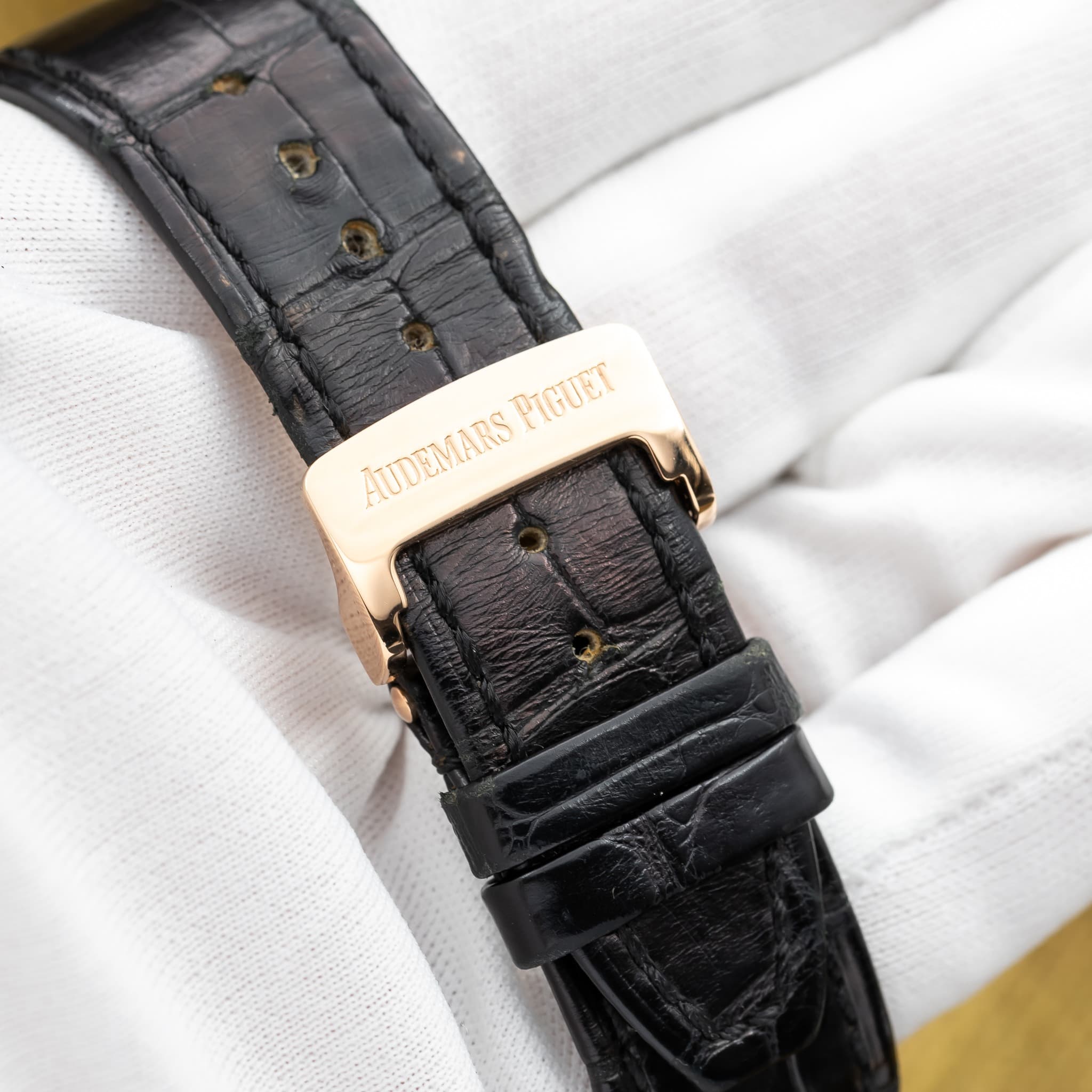 May be an image of leather, wrist watch and text