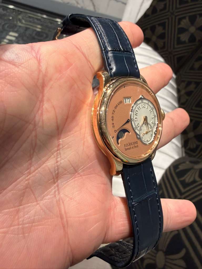 May be an image of wrist watch and text
