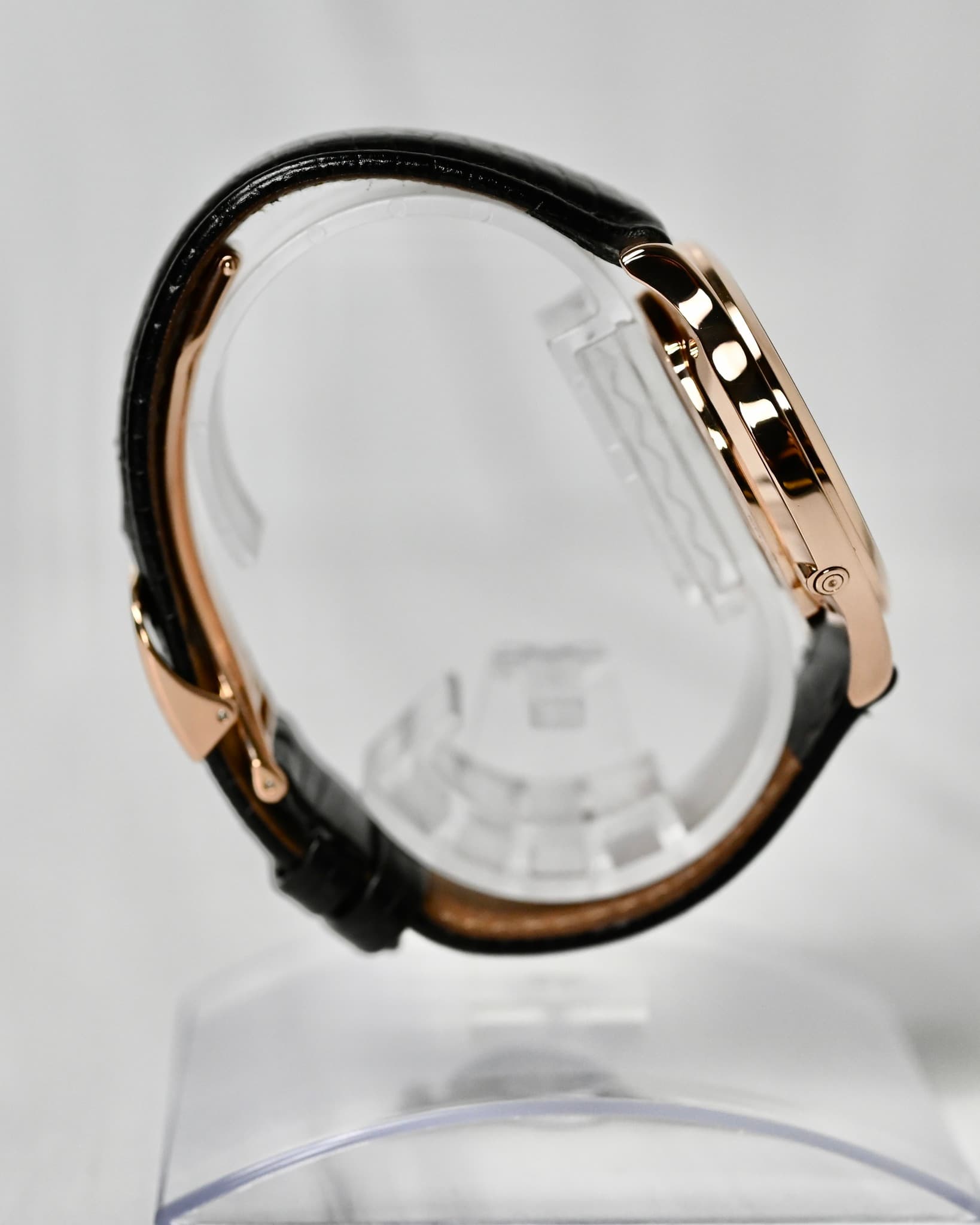 May be an image of wrist watch, glasses, strap and text