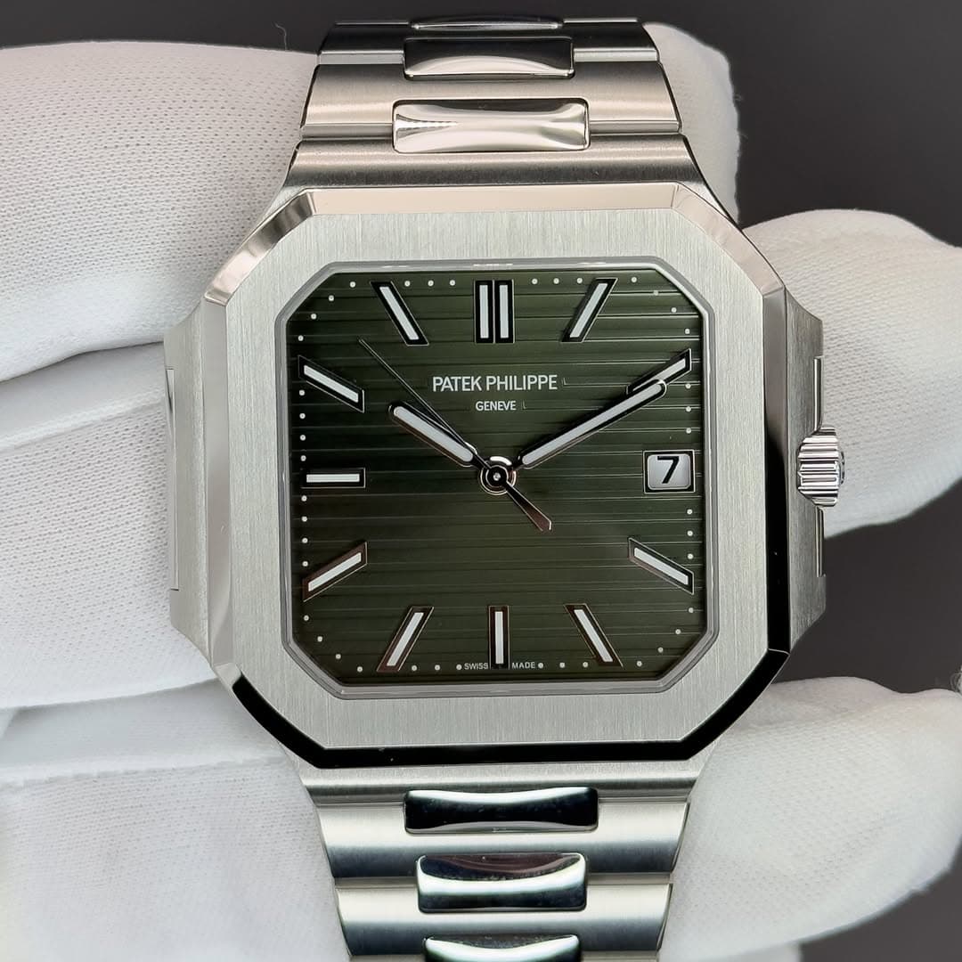 May be an image of wrist watch and text that says 'PATEK reK GENEVE 7 ١ ® MADE'