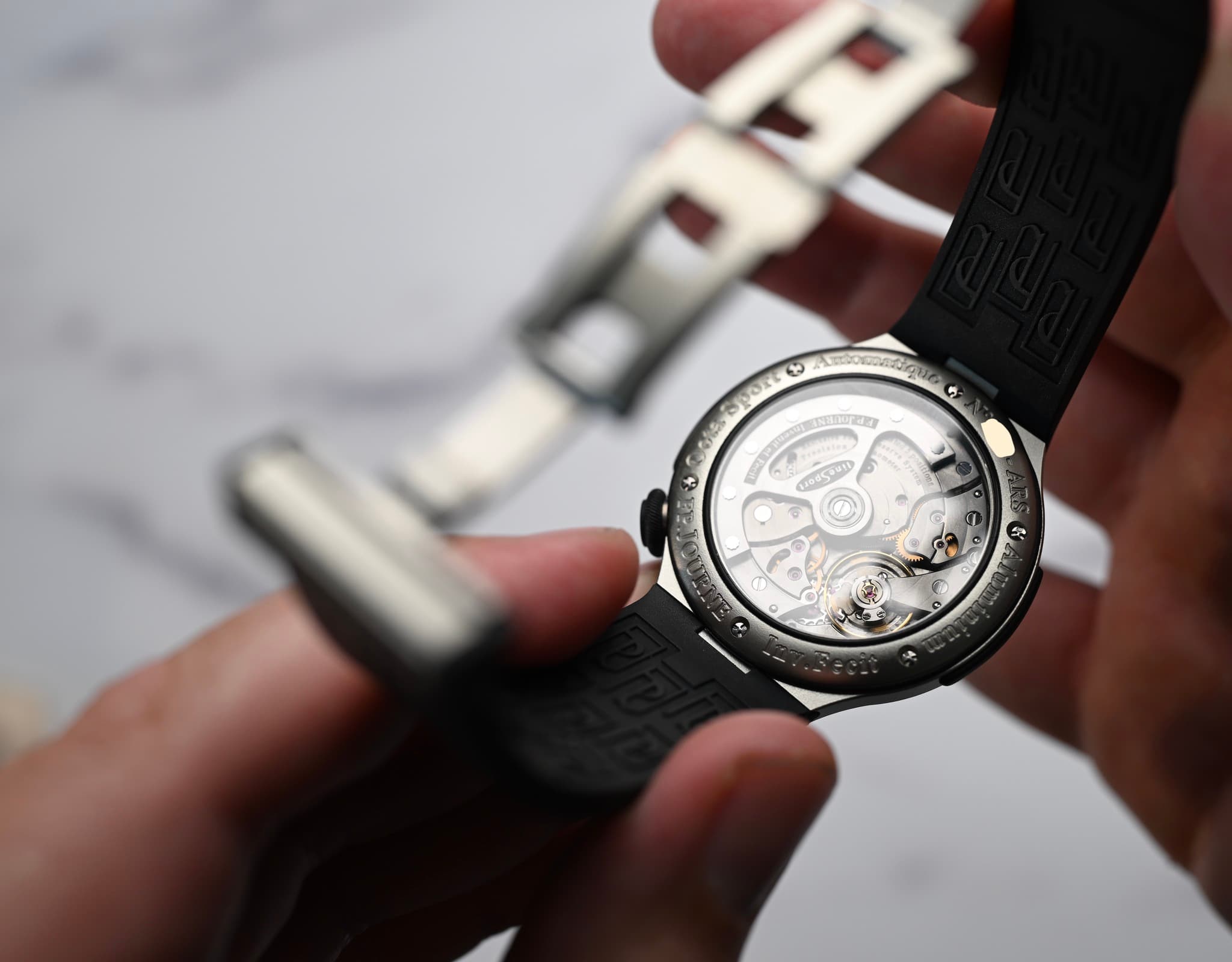 May be an image of wrist watch and text
