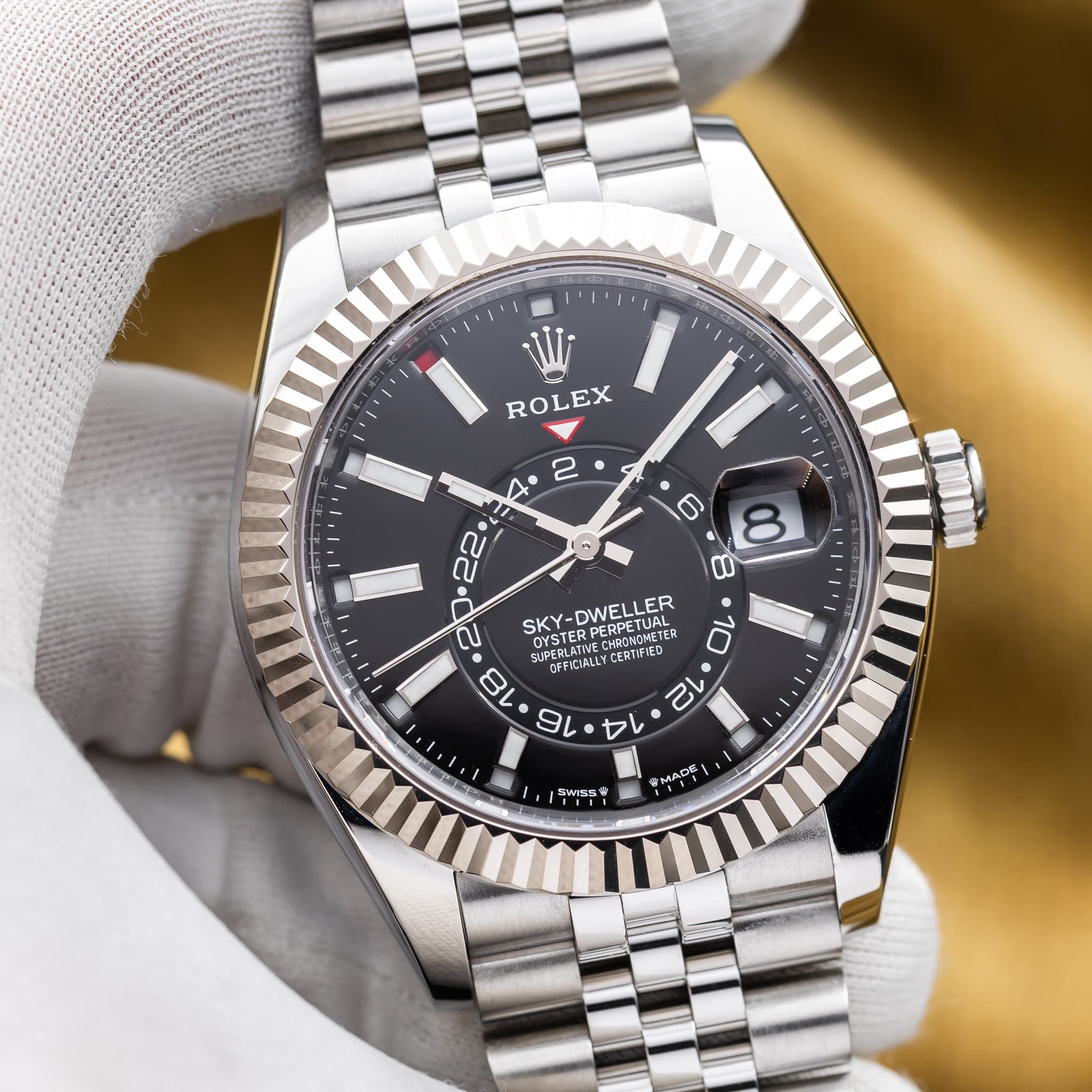May be an image of wrist watch and text