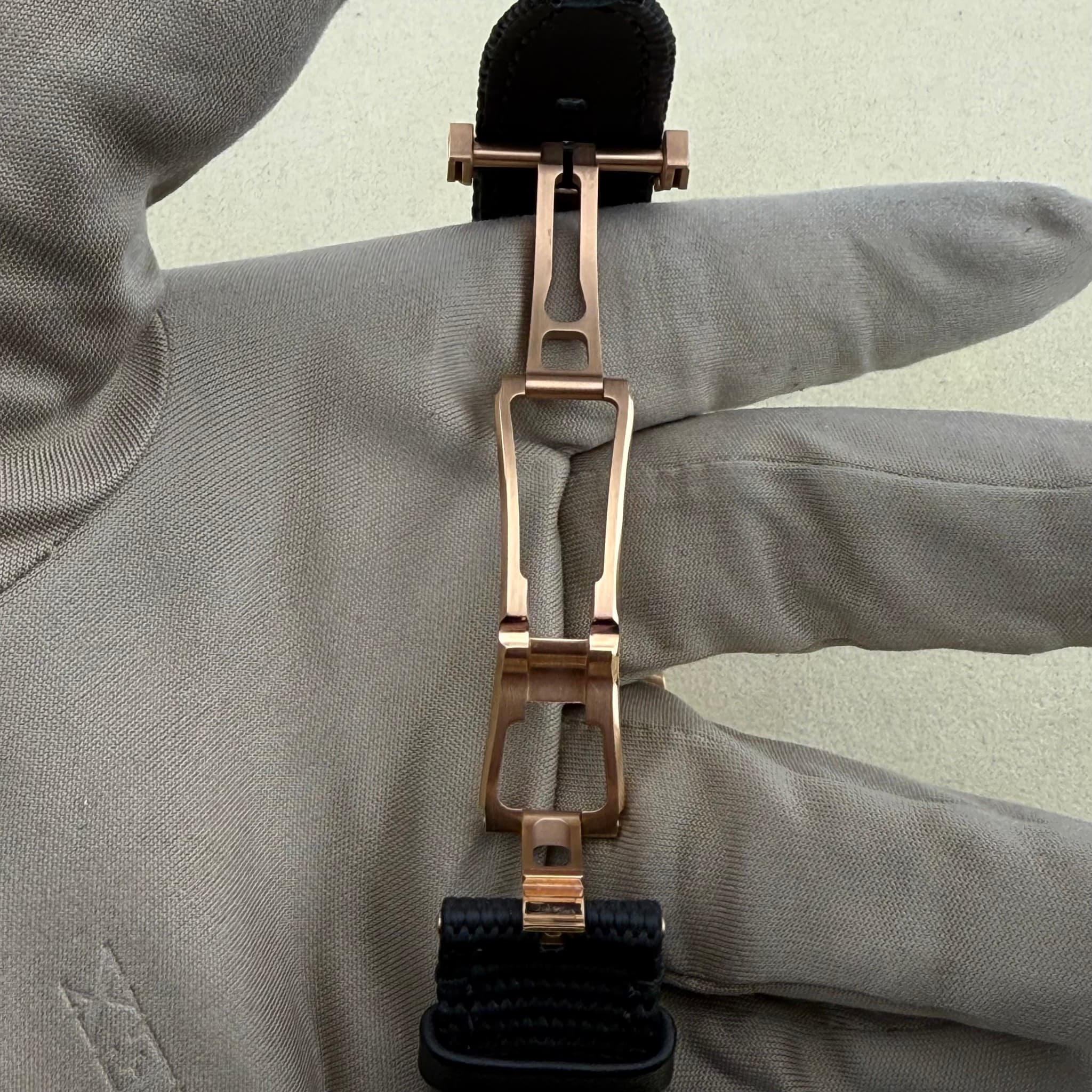 May be an image of brass and wrist watch