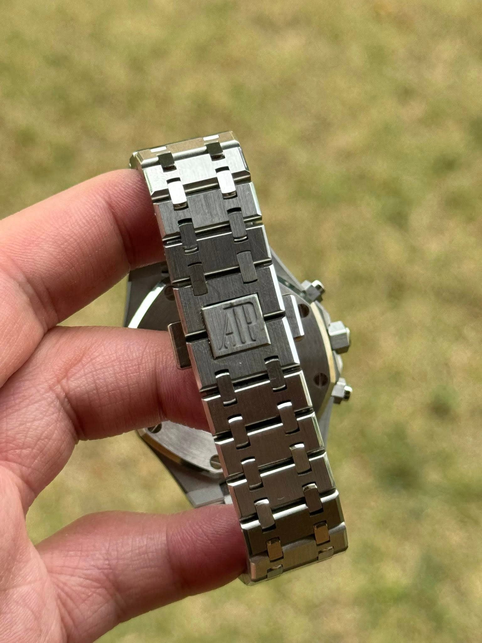 May be an image of wrist watch and text