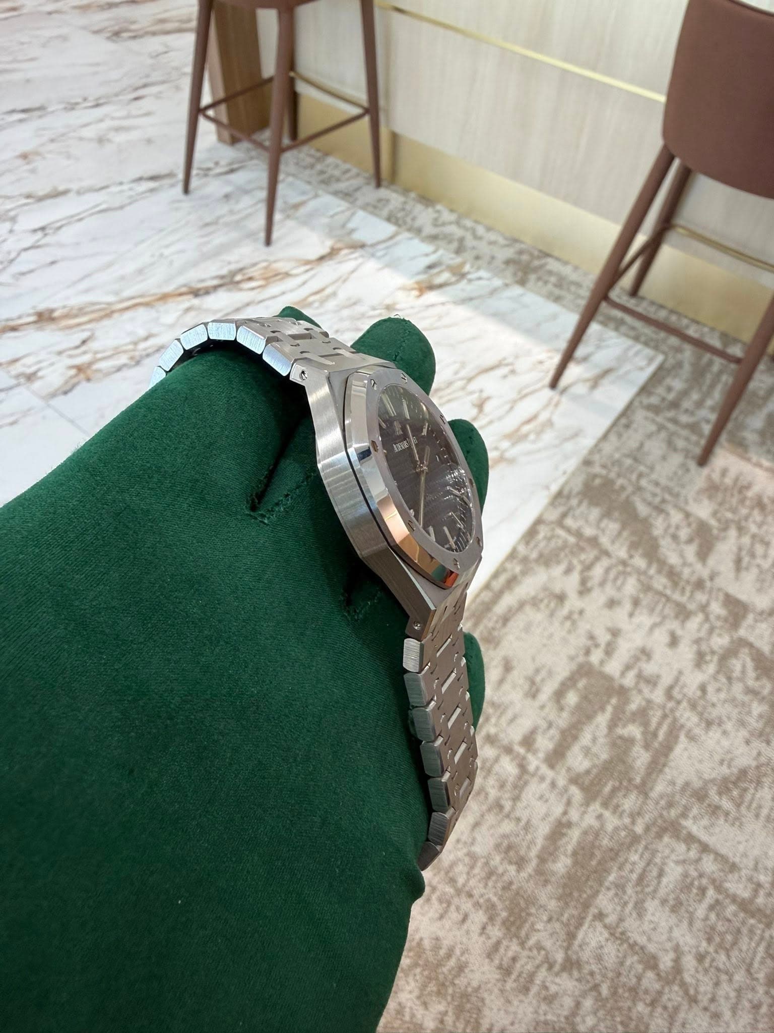 May be an image of wrist watch and indoors