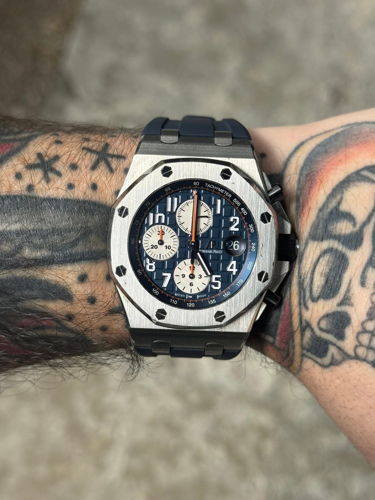 May be an image of wrist watch and text