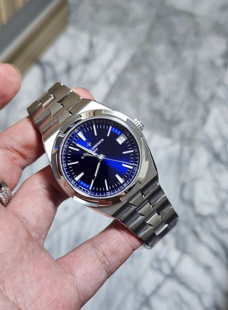 May be an image of wrist watch and text that says '60 O ዋ trim 3 CON NEVE CONSTANTIN INTIN 56 45 O TE S'