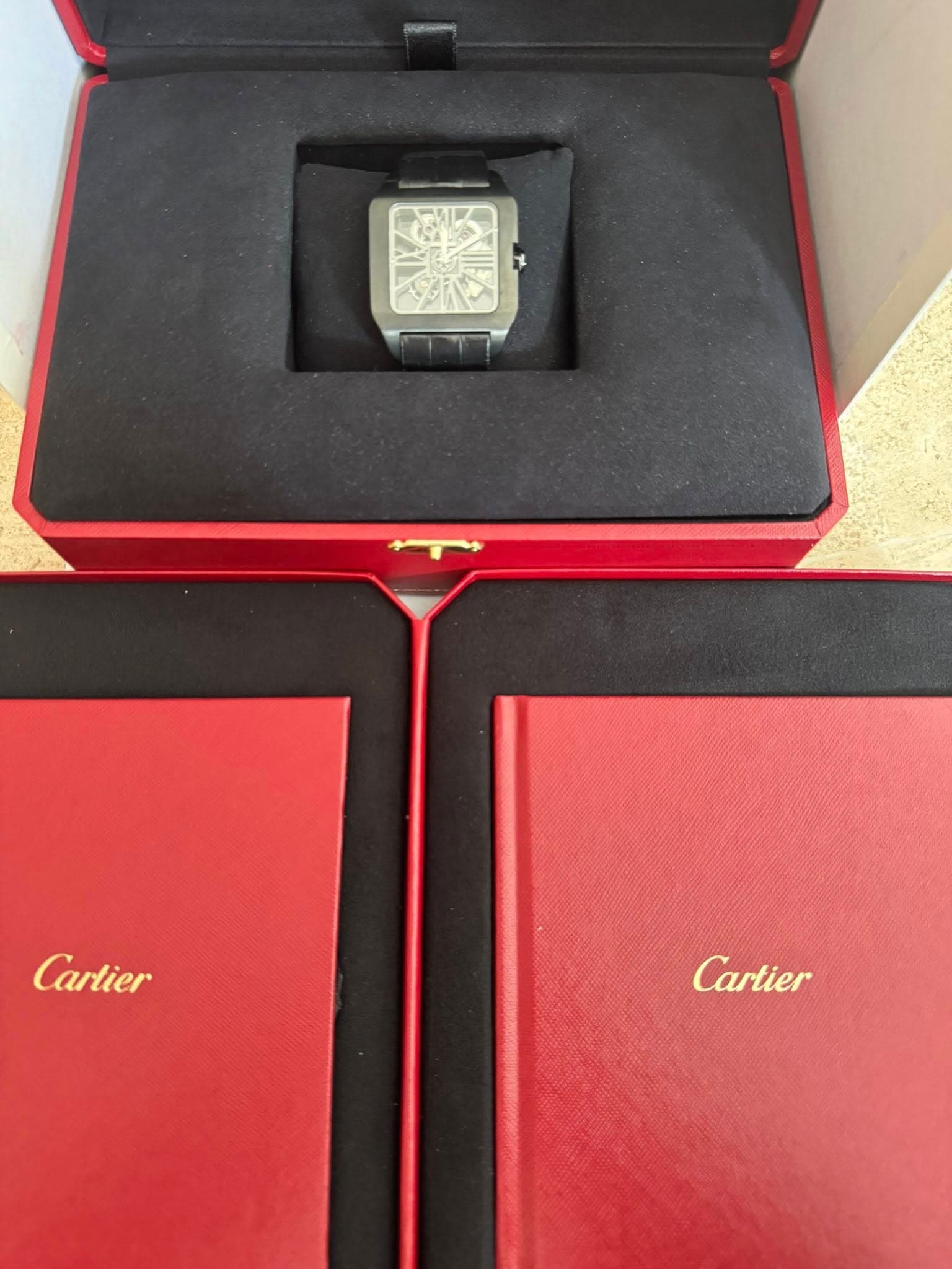May be an image of digital watch and text that says 'Cartier Cartier'