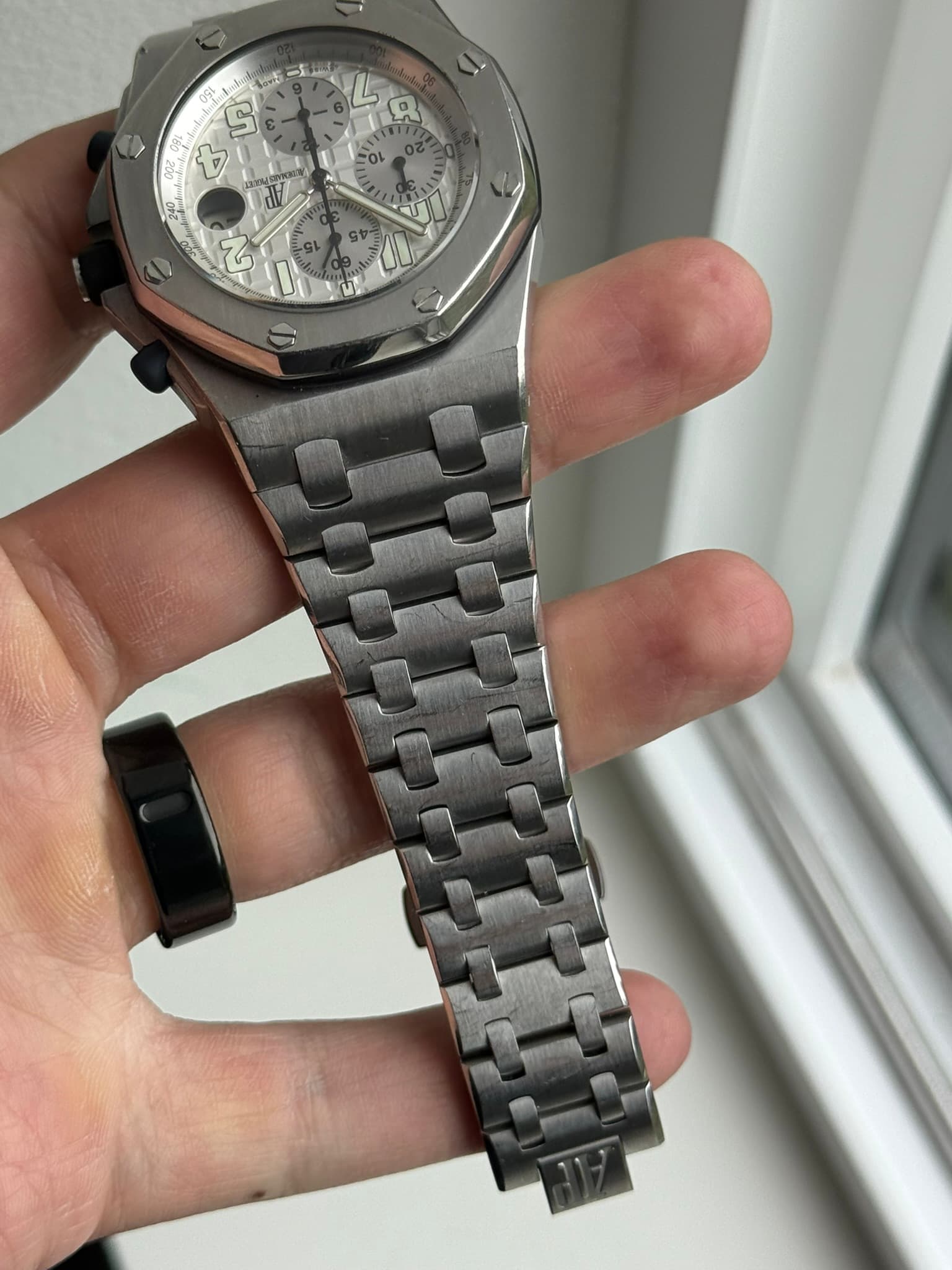 May be an image of wrist watch and text