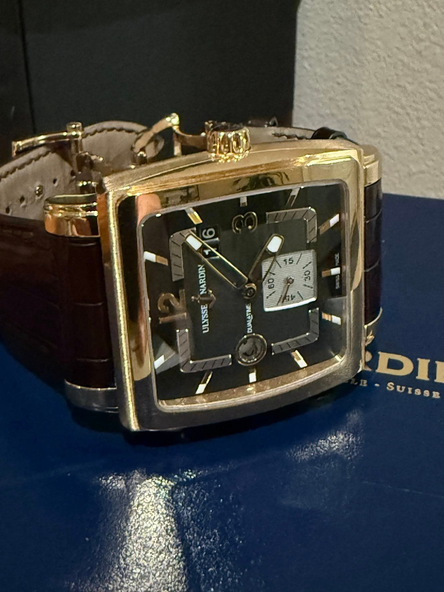 May be an image of wrist watch and text