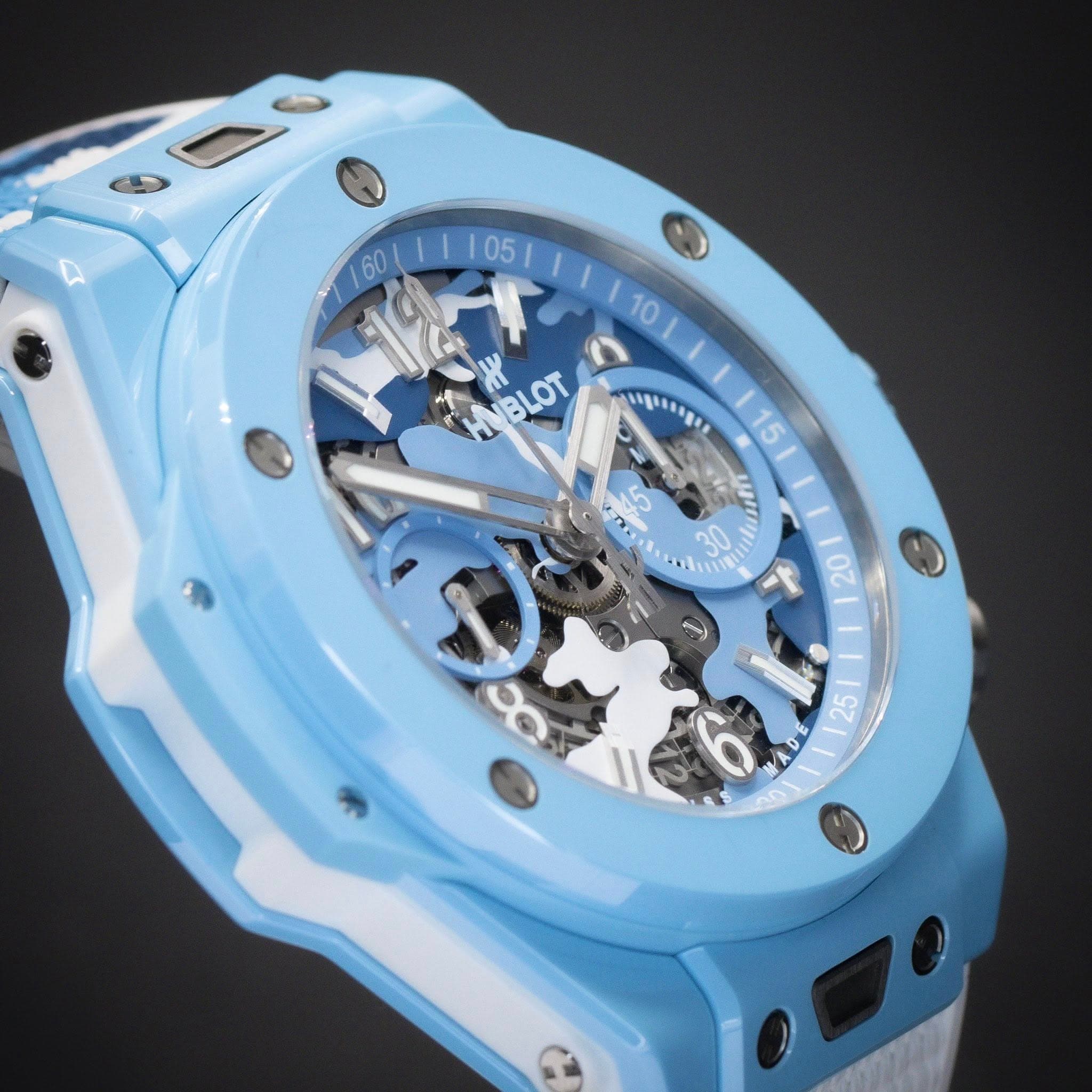 May be an image of wrist watch and text that says '60 160/ HNBLOT BLOT 15 V TM NO 6 20 X 20 ف = DCY 25 DE'