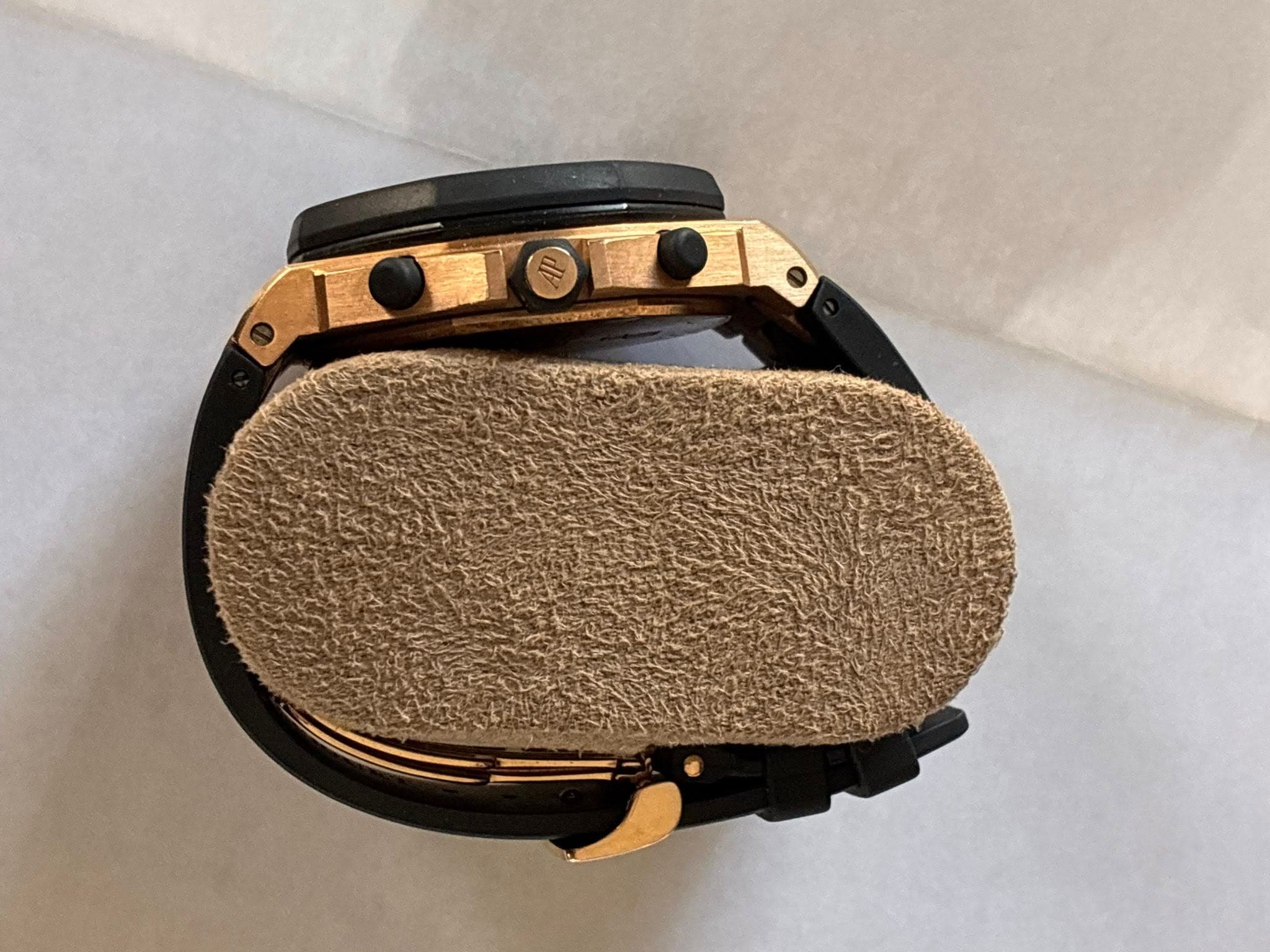 May be an image of leather, wrist watch, saddle-stitched leather and espadrilles