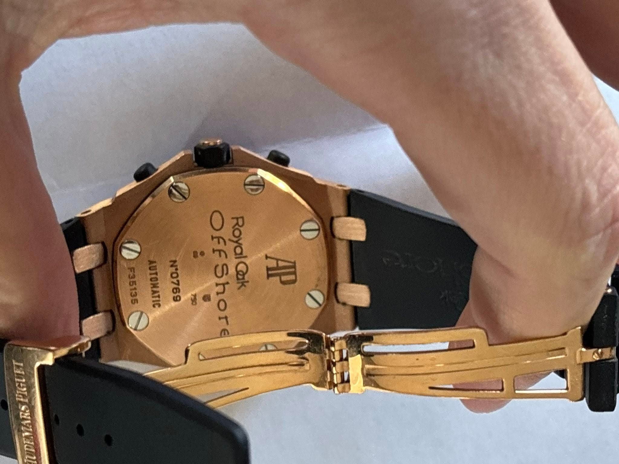 May be an image of wrist watch and text