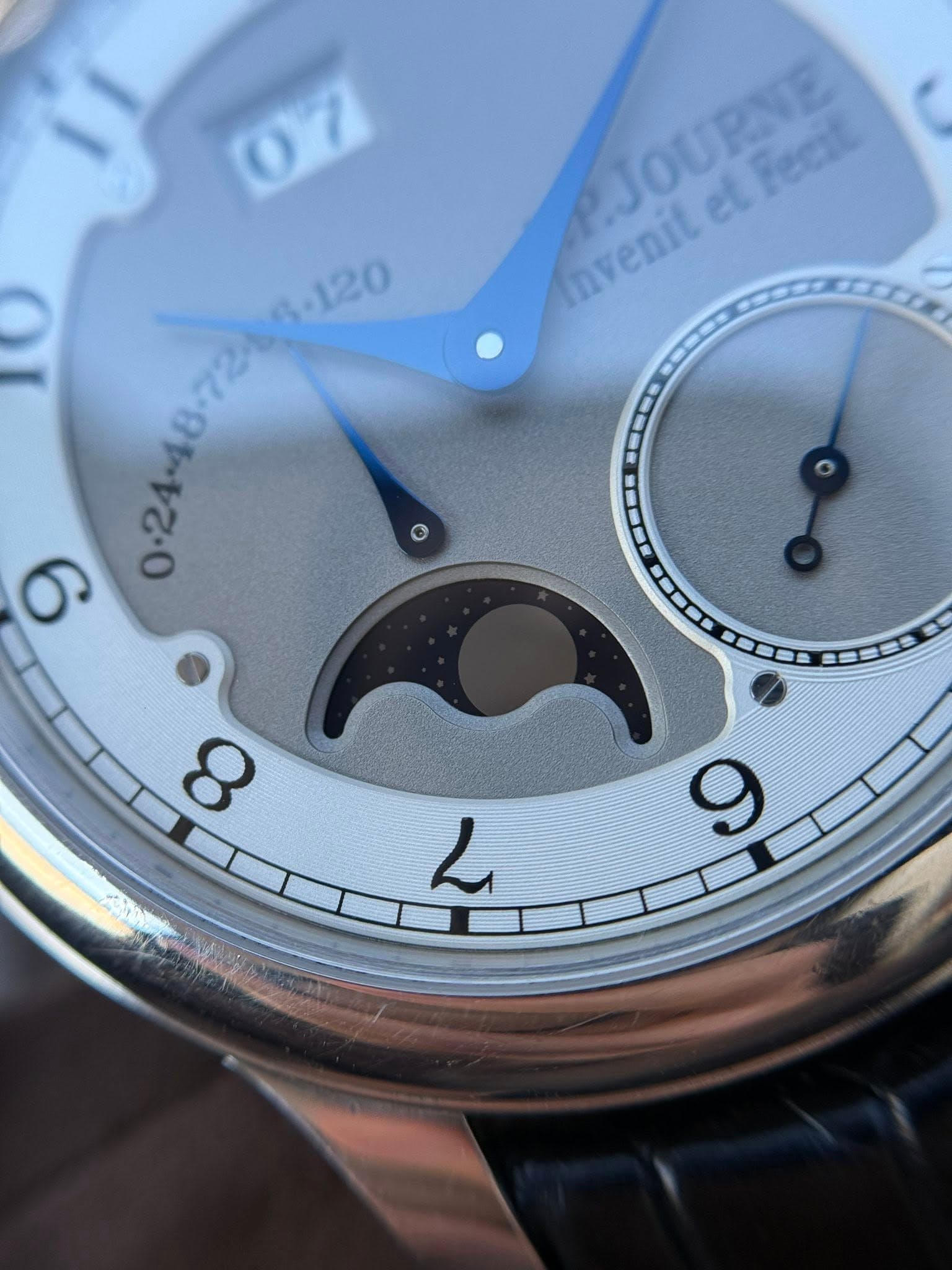 May be an image of wrist watch and text