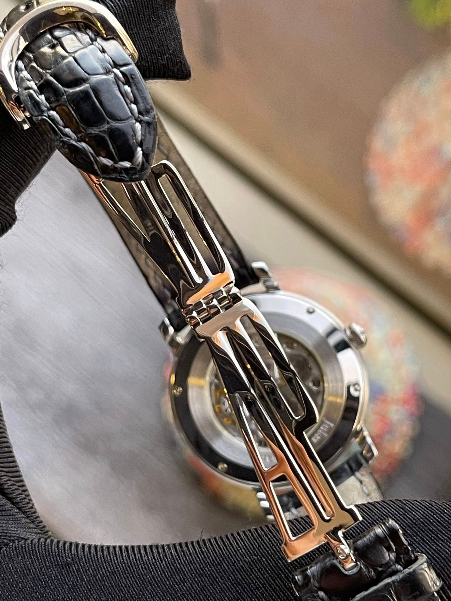 May be an image of wrist watch and text