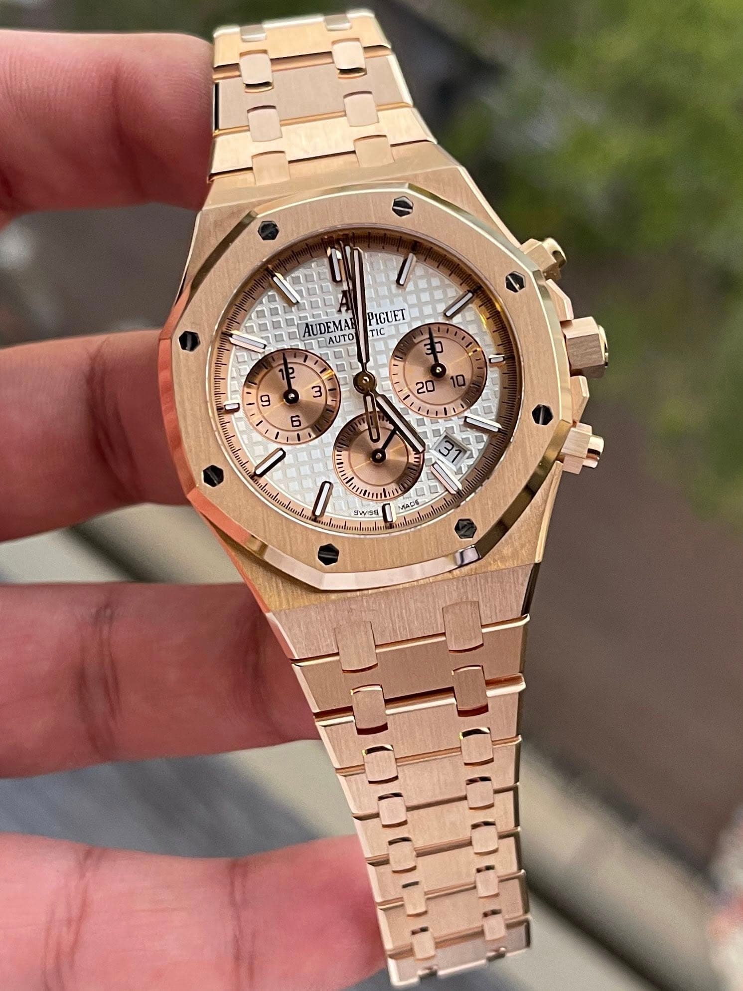 May be an image of wrist watch and text