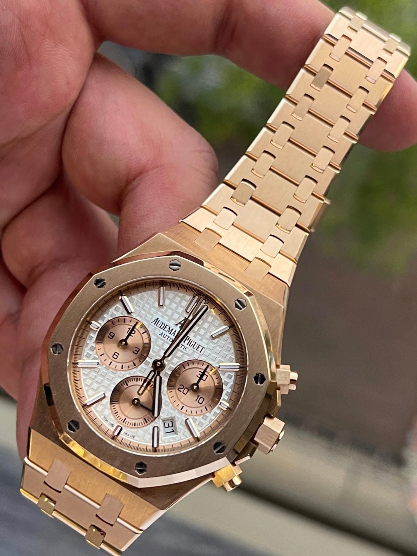 May be an image of wrist watch and text