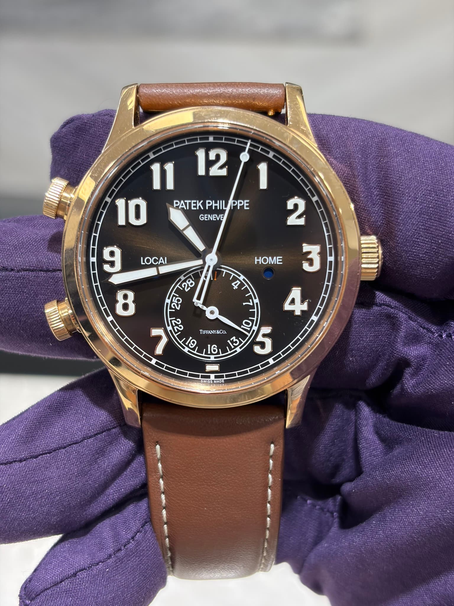 May be an image of leather, wrist watch and text that says 'HOME 11 1112/ PATEK PHILIPPE PATEKPHILIPPE PPE GENEVE 2 9 LOCAI ד O 5 7 [IFFANTACO 13 M 19 9 [6 9 M 4 ٣ 人'