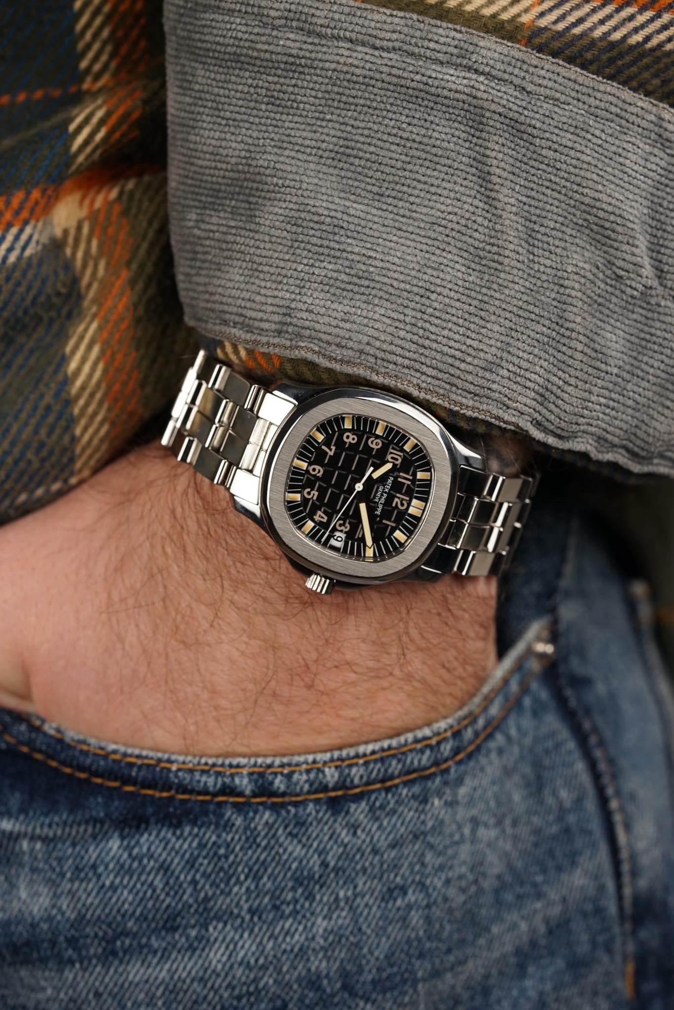 May be an image of wrist watch and text