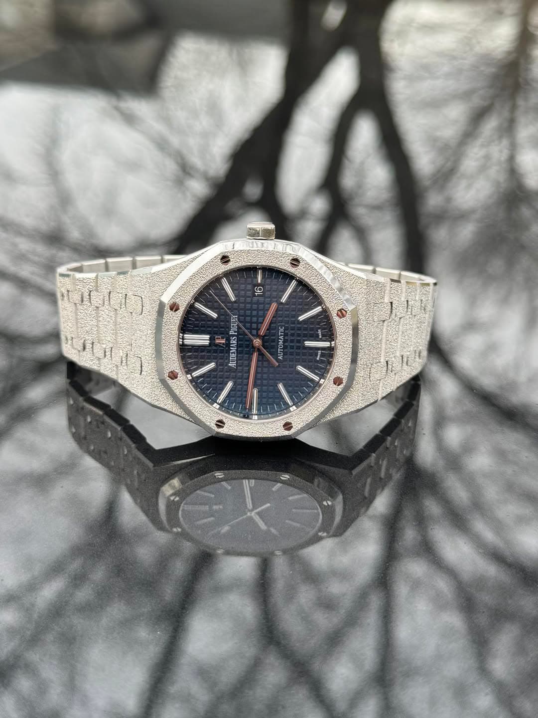 May be an image of wrist watch and text