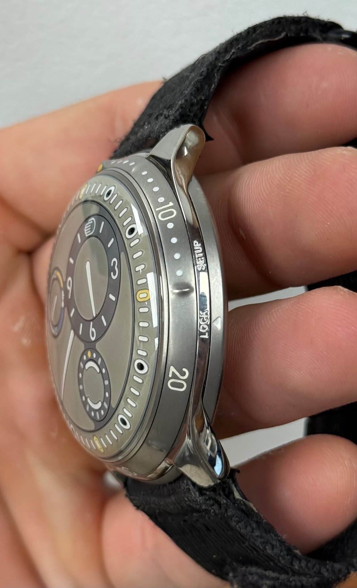 May be an image of wrist watch and text