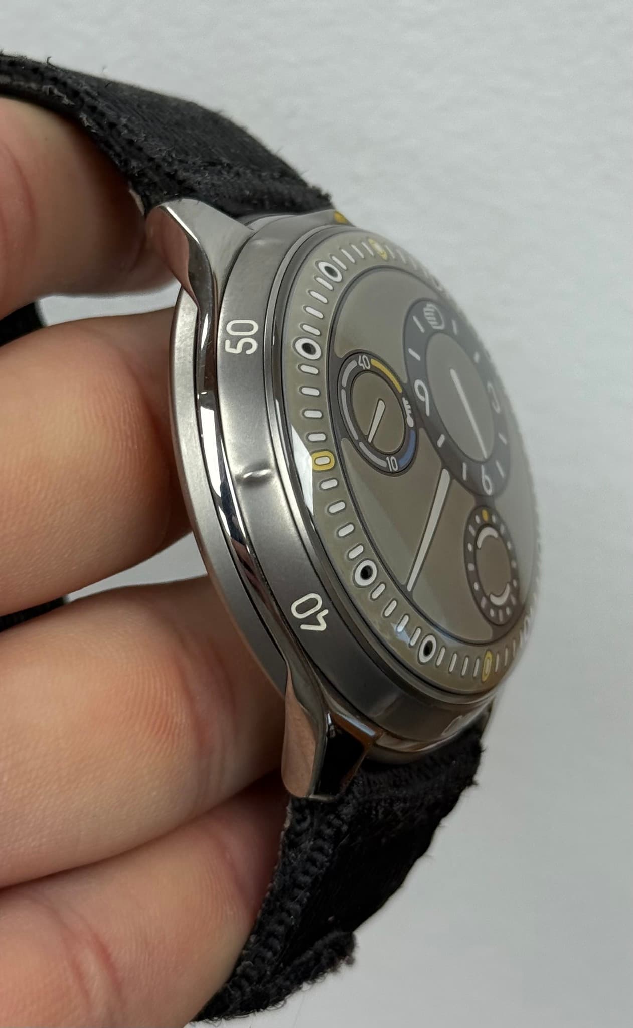 May be an image of wrist watch and text