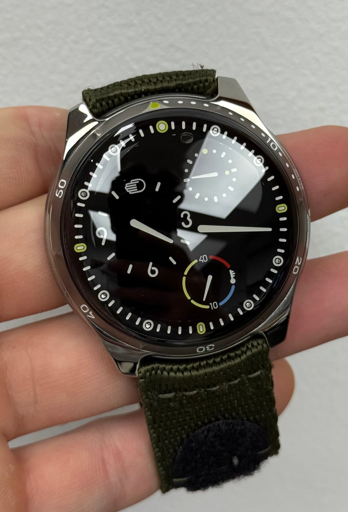May be an image of wrist watch and text