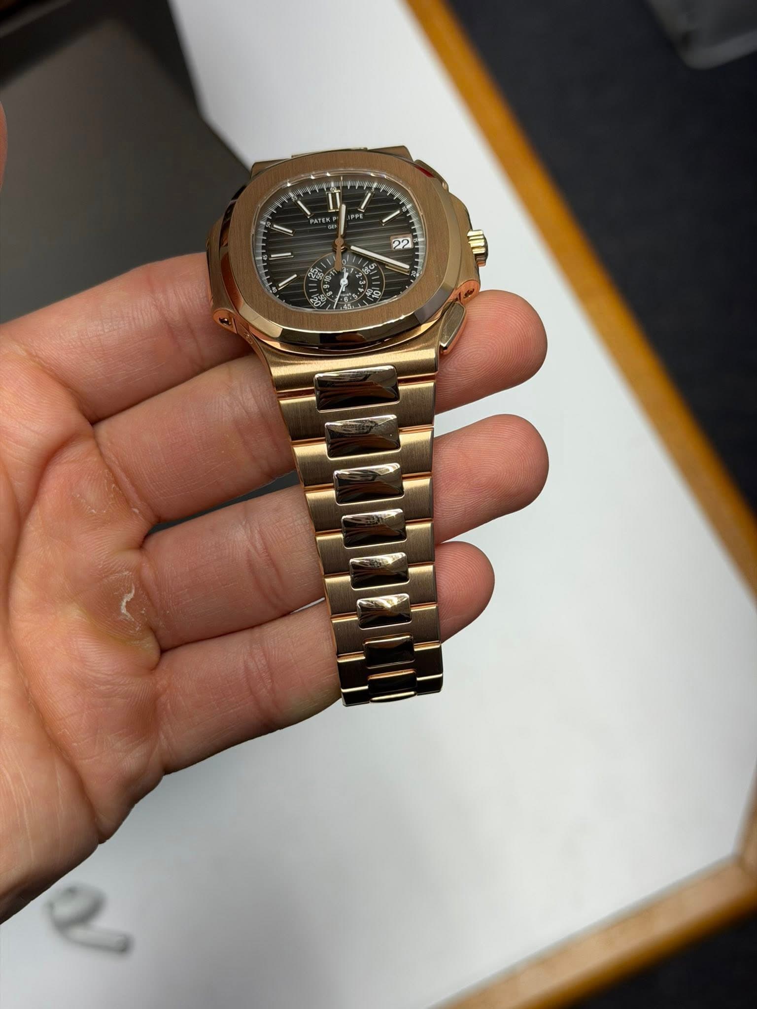May be an image of wrist watch and text