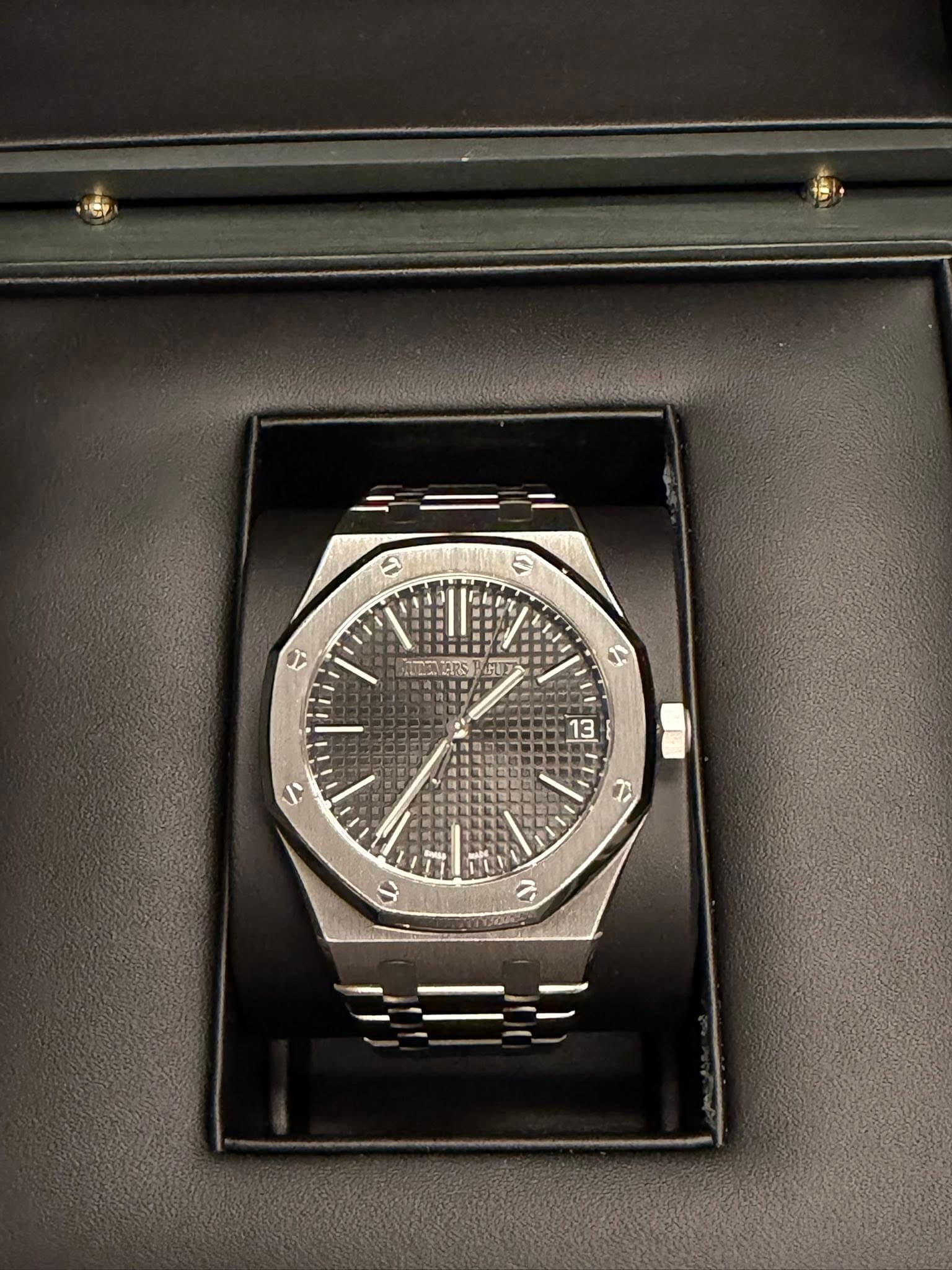 May be an image of wrist watch and text