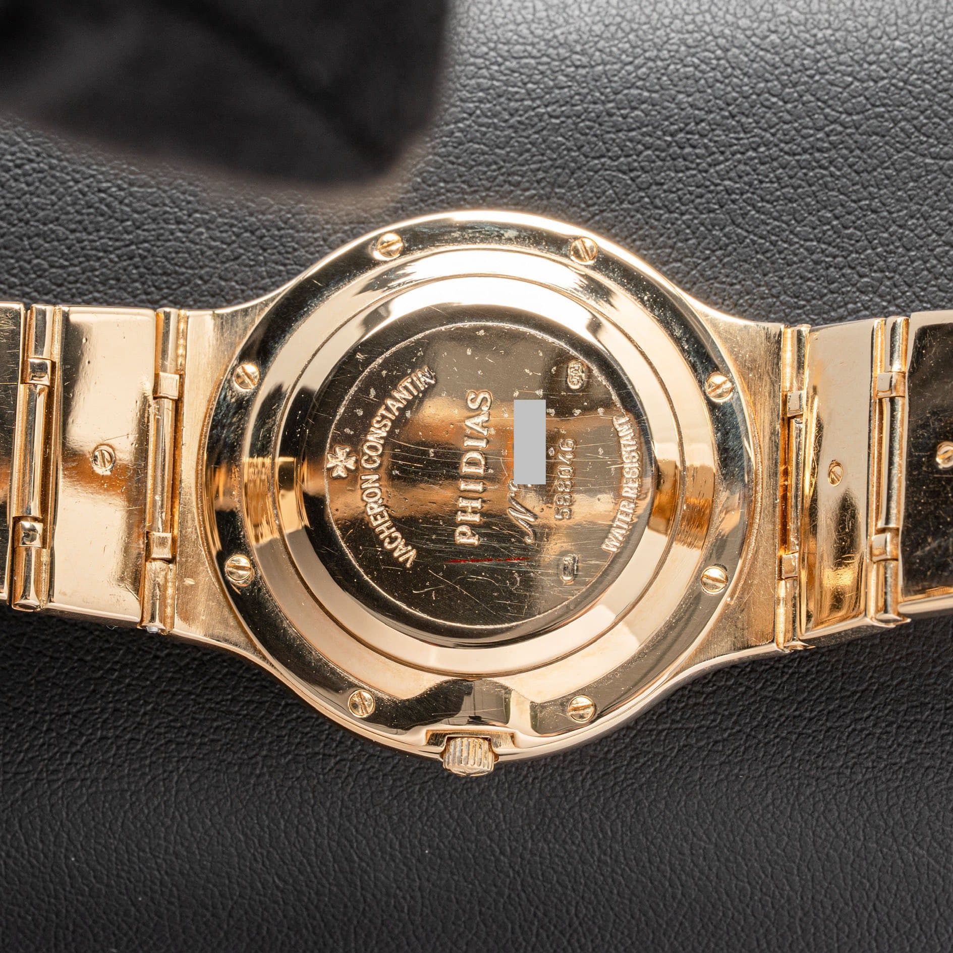May be an image of jewelry, digital watch and text