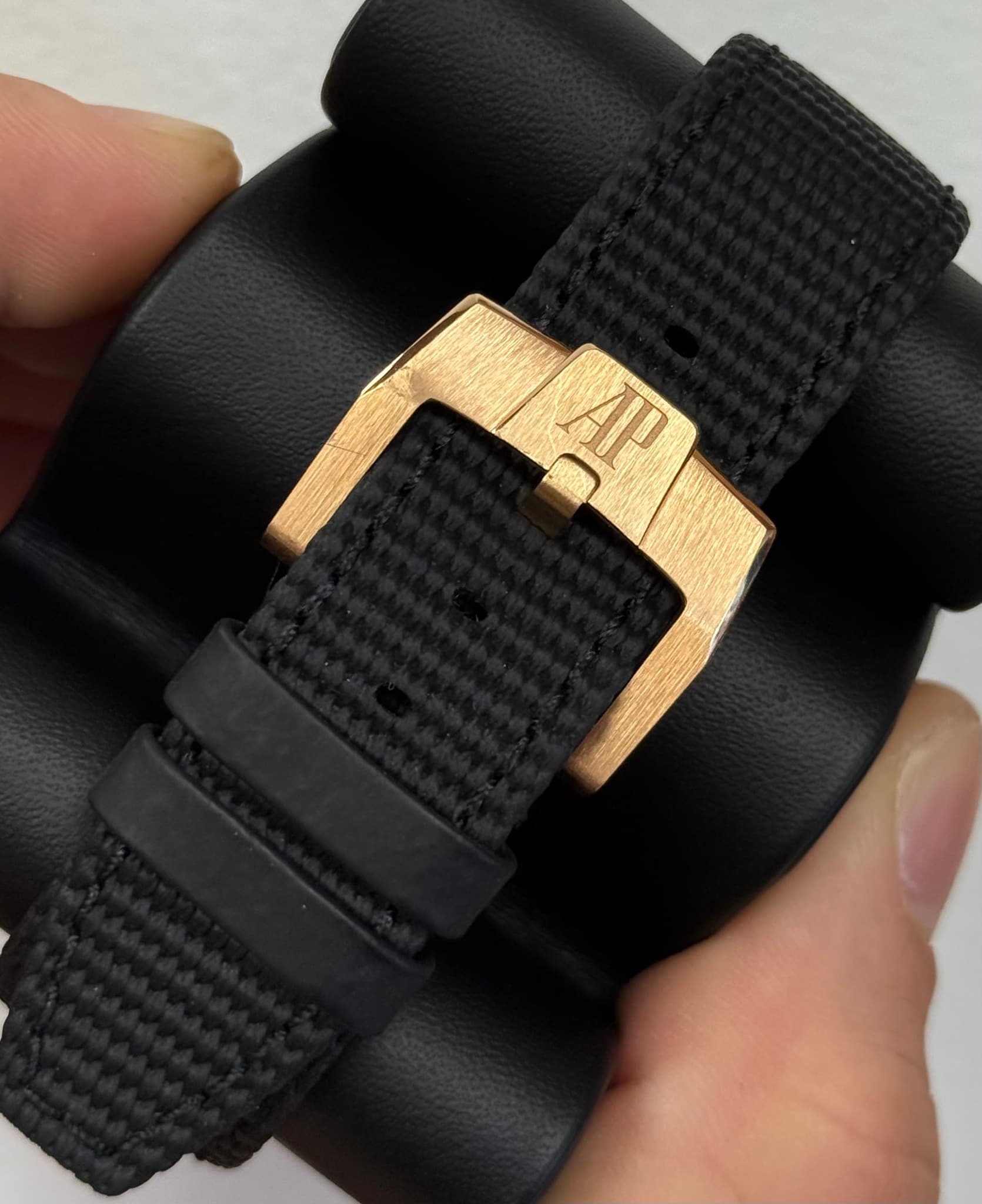 May be an image of saddle-stitched leather, digital watch and leather