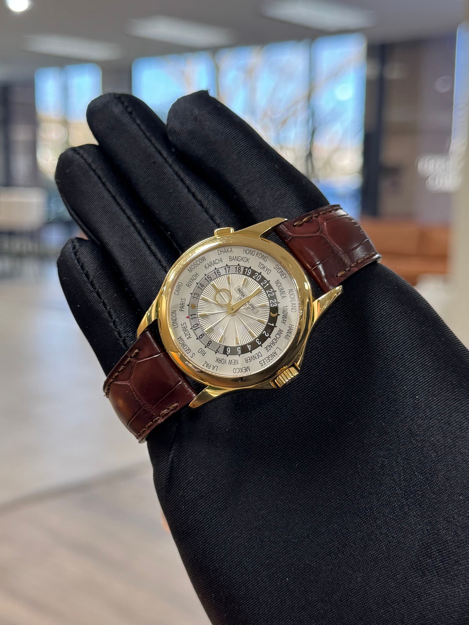 May be an image of leather, wrist watch and text