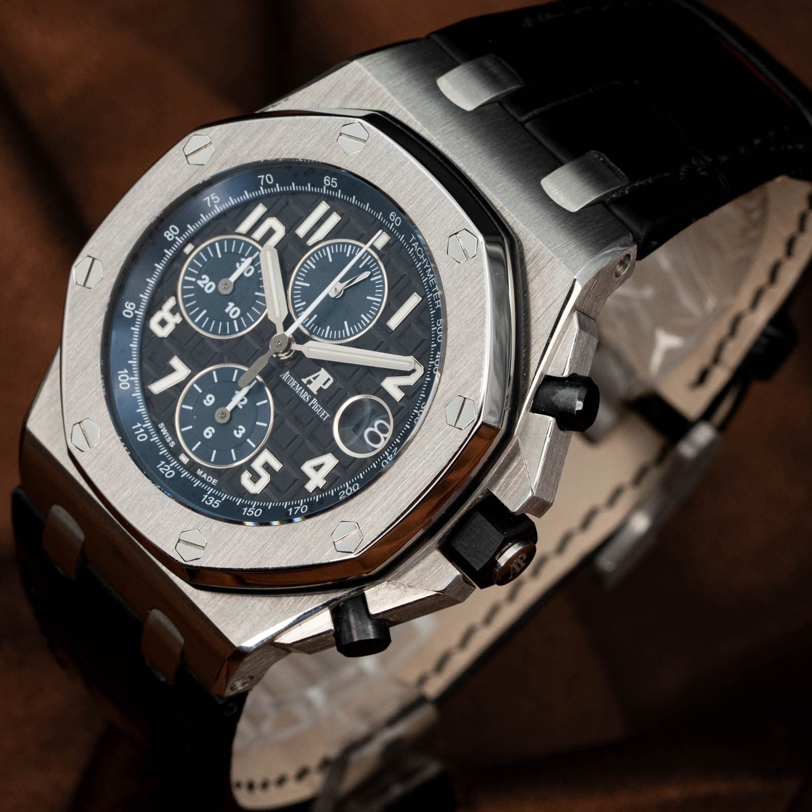 May be an image of wrist watch and text