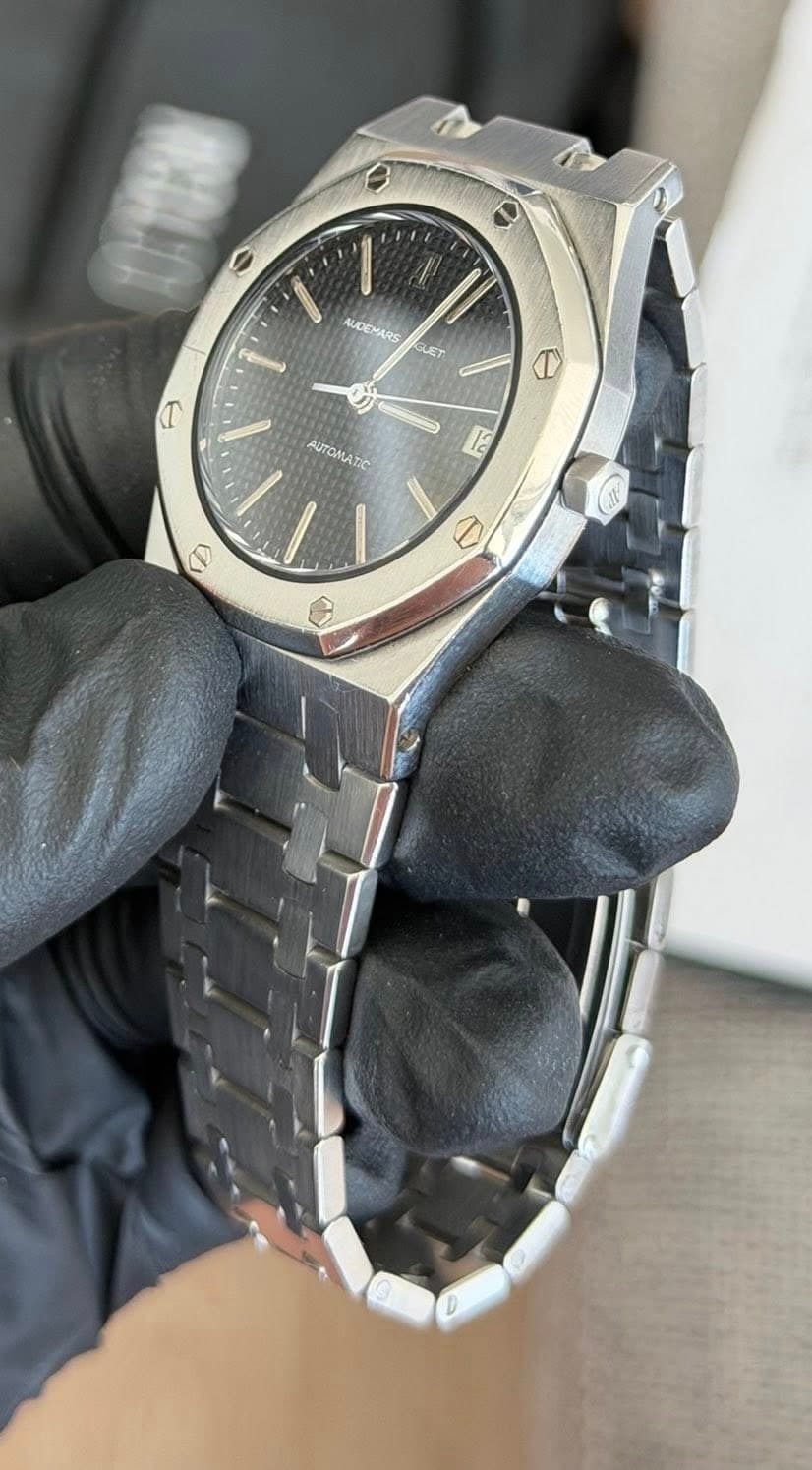 May be an image of wrist watch and text