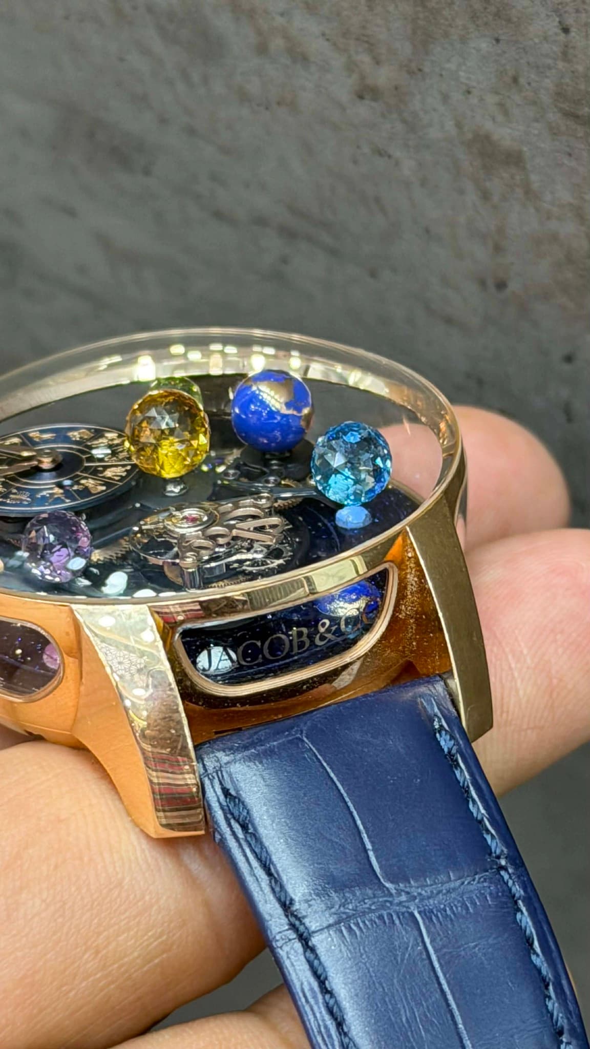 May be an image of wrist watch and text